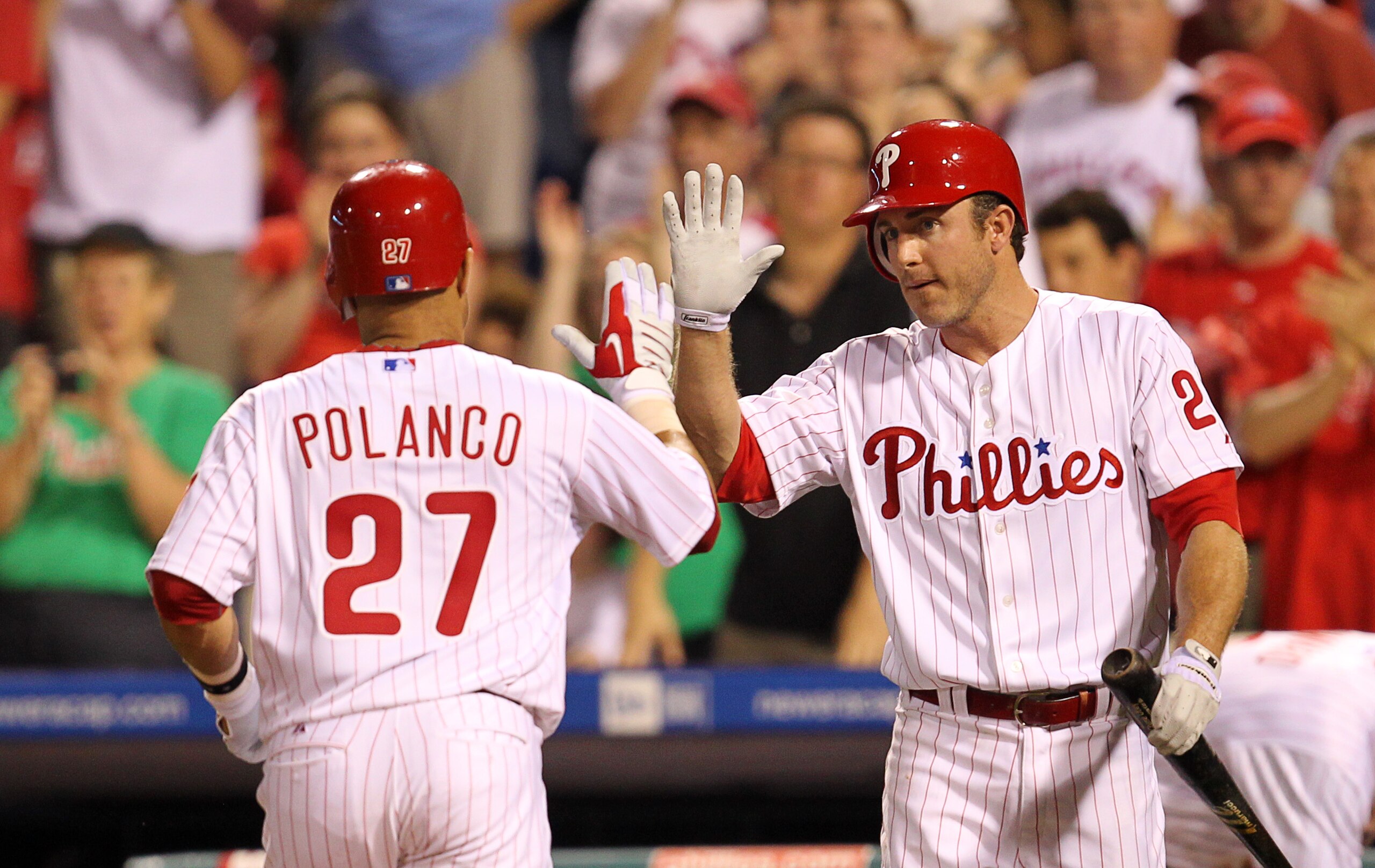 PHILADELPHIA - MAY 2: Third baseman Placido Polanco #27 is greeted by second baseman Chase Utley #26 of the Philadelphia Phillies after hitting a home run during a game against the New York Mets at Citizens Bank Park on May 2, 2010 in Philadelphia, Pennsy