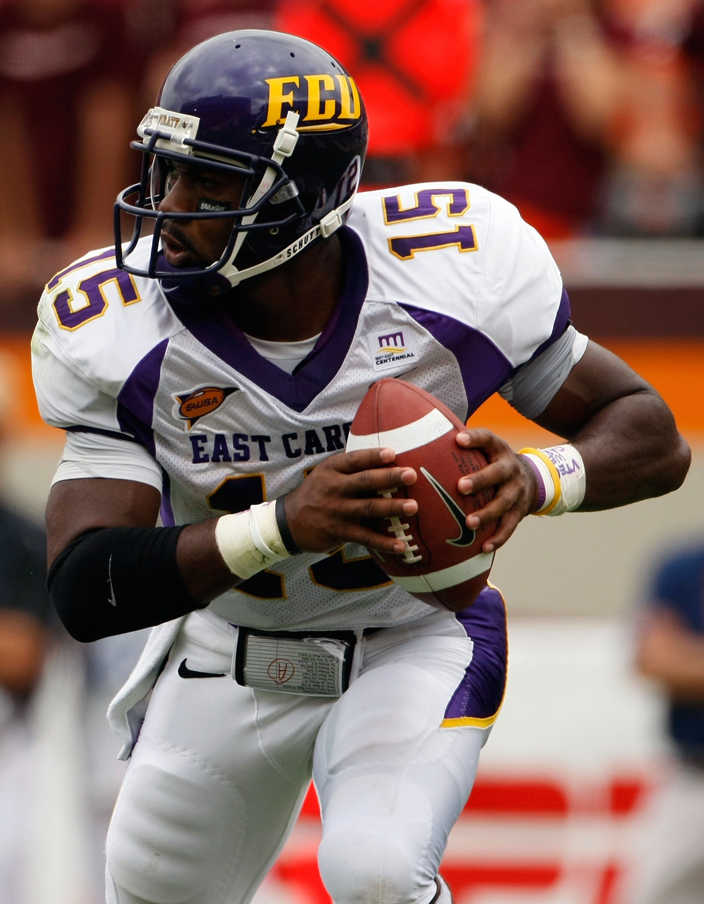 BLACKSBURG, VA - SEPTEMBER 01:  Quarterback Patrick Pinkney of the East Carolina Pirates rolls out of the pocket to pass in the third quarter against the Virginia Tech Hokies on September 1, 2007 at Lane Stadium in Blacksburg, Virginia. Virginia Tech won