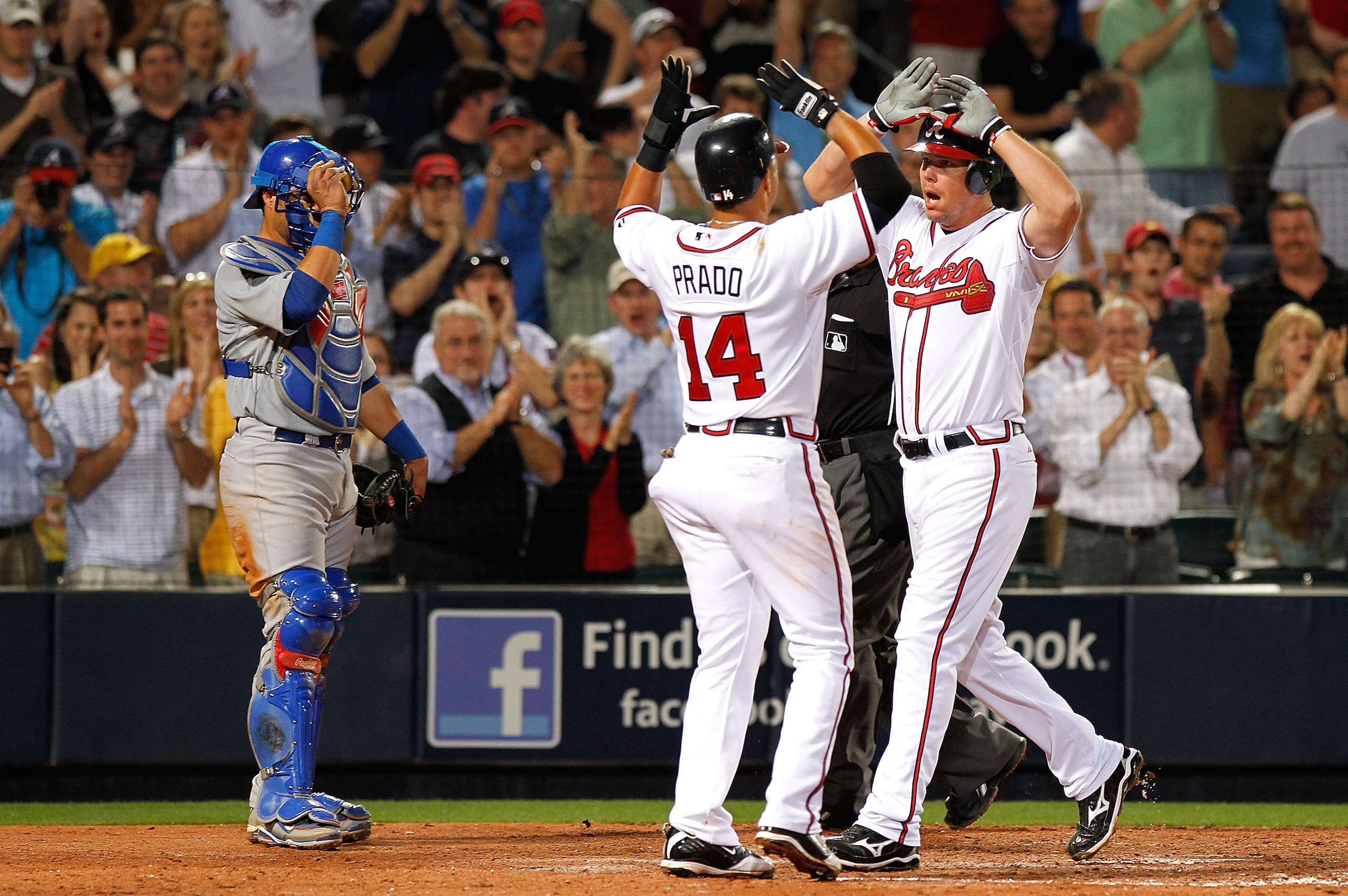 ATLANTA - APRIL 07:  Catcher Geovany Soto #18 of the Chicago Cubs watches as Martin Prado #14 congratulates Chipper Jones #10 of the Atlanta Braves after Jones' two-run homer in the eighth inning at Turner Field on April 7, 2010 in Atlanta, Georgia.  (Pho