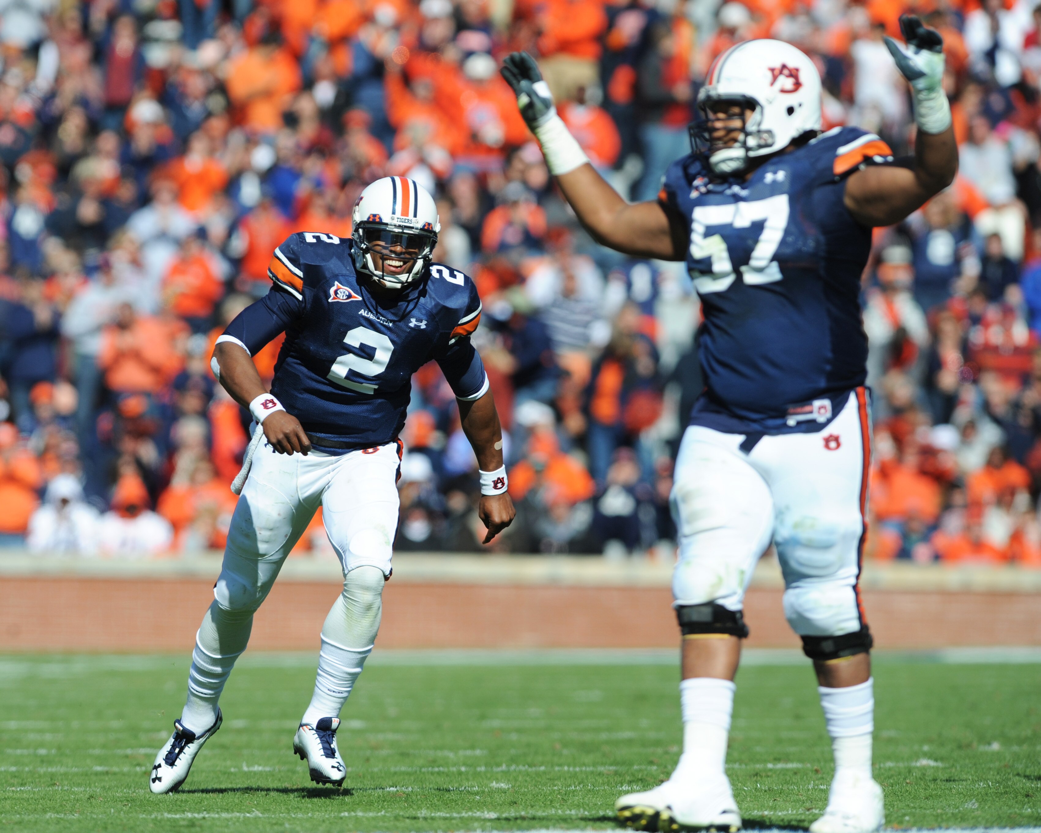 AUBURN, AL - NOVEMBER 6:  Quarterback Cam Newton #2 of the Auburn Tigers runs to celebrate a touchdown against the Chattanooga Mocs November 6, 2010 at Jordan-Hare Stadium in Auburn, Alabama.  (Photo by Al Messerschmidt/Getty Images)