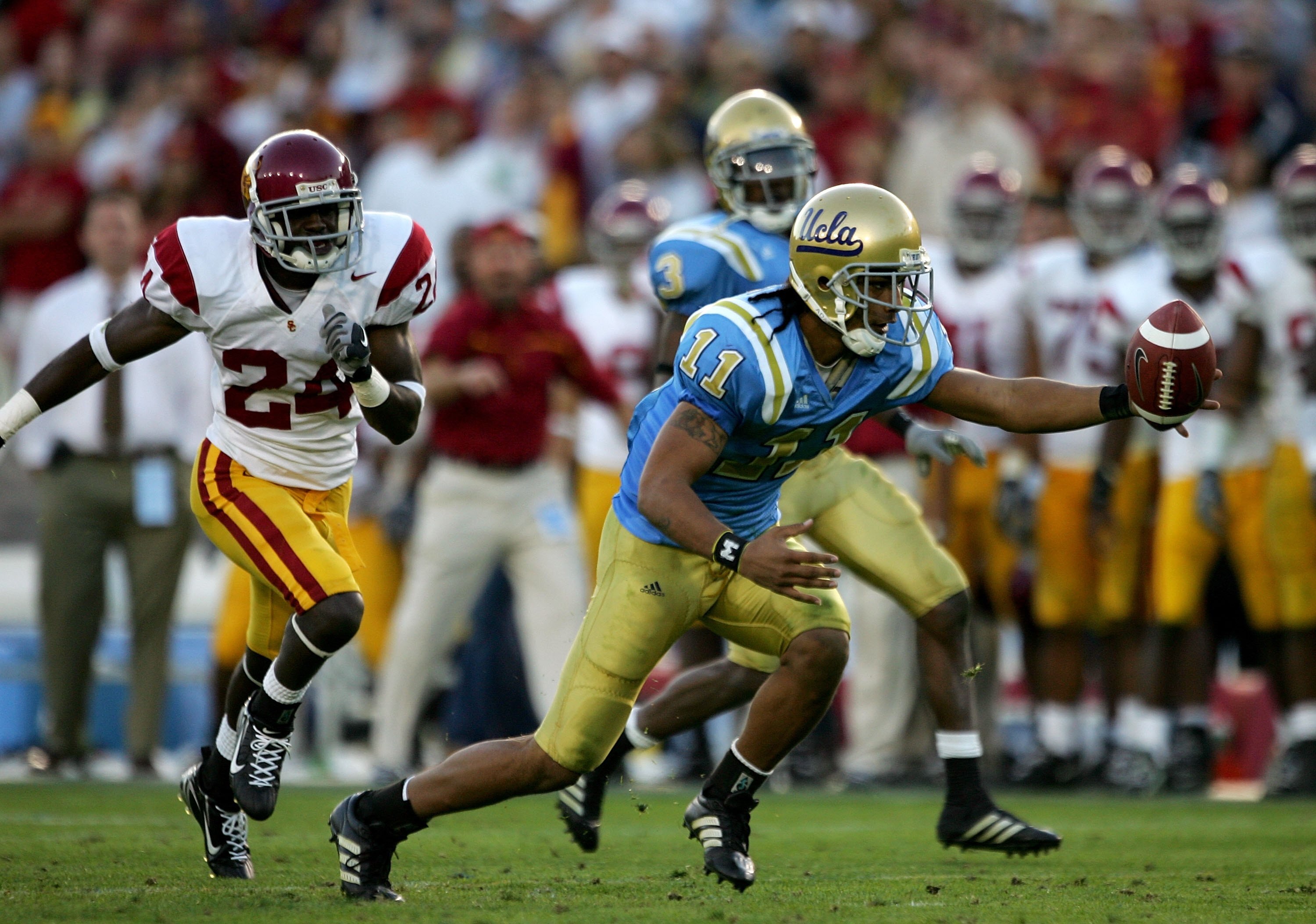 PASADENA, CA - DECEMBER 02:  Dennis Keyes #11 of the UCLA Bruins tries to recover a fumble on a kickoff return during the game against the USC Trojans on December 2, 2006 at the Rose Bowl in Pasadena, California. The UCLA Bruins defeated the USC Trojans 1