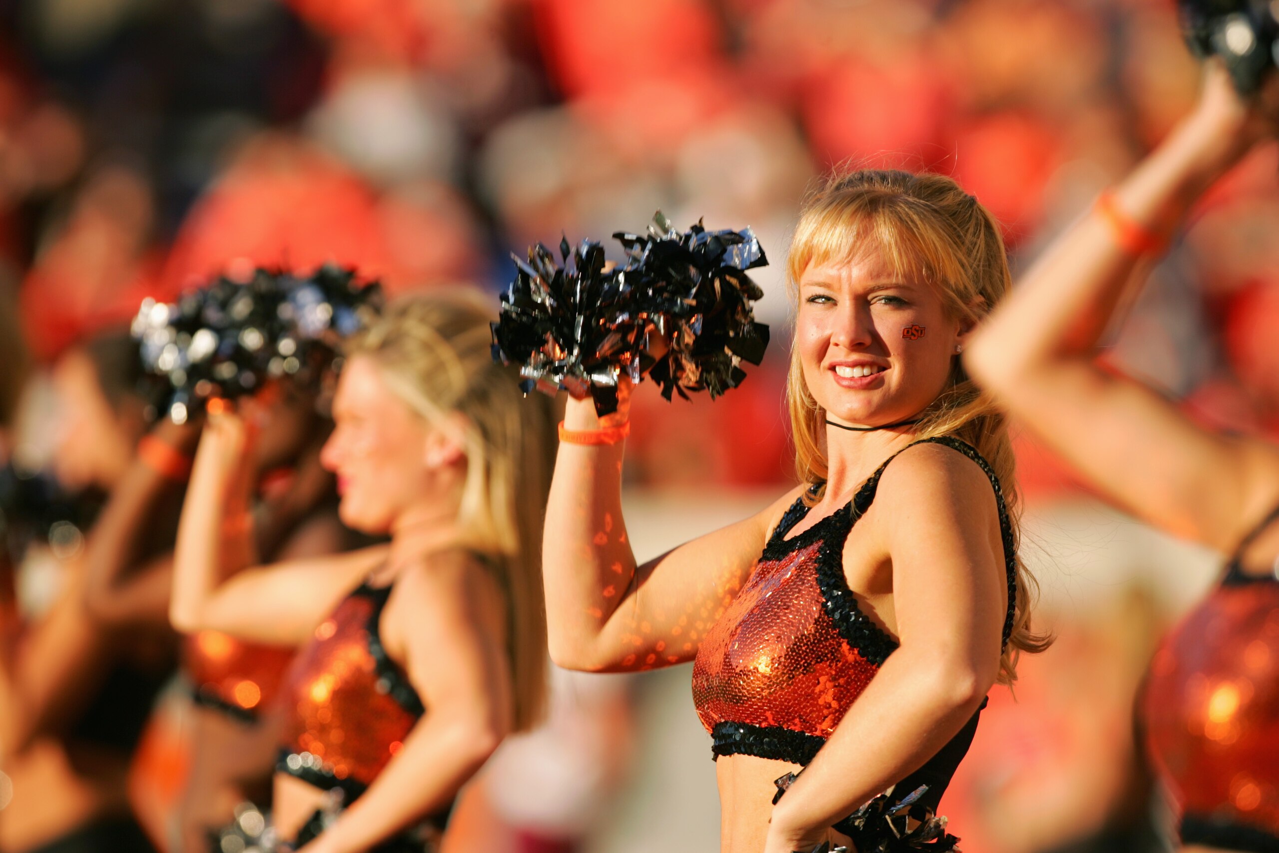 STILLWATER, OKLAHOMA - OCTOBER 16:  Cheerleaders perform during the game between the Texas A&M Aggies and Oklahoma State Cowboys at Boone Pickens Stadium on October 16, 2004 in Stillwater, Oklahoma. Texas A&M beat Oklahoma State 36-20. (Photo by Harry How