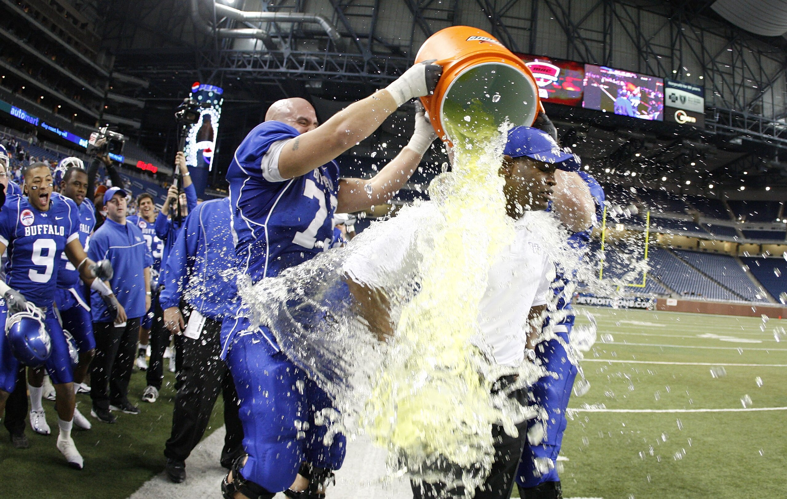 DETROIT - DECEMBER 05: Head coach Turner Gill of the Buffalo Bulls is showered with Gatorade by Peter Bittner #73 late in the fourth quarter during the MAC Championship game against the Ball State Cardinals on December 5, 2008 at Ford Field in Detroit, Mi