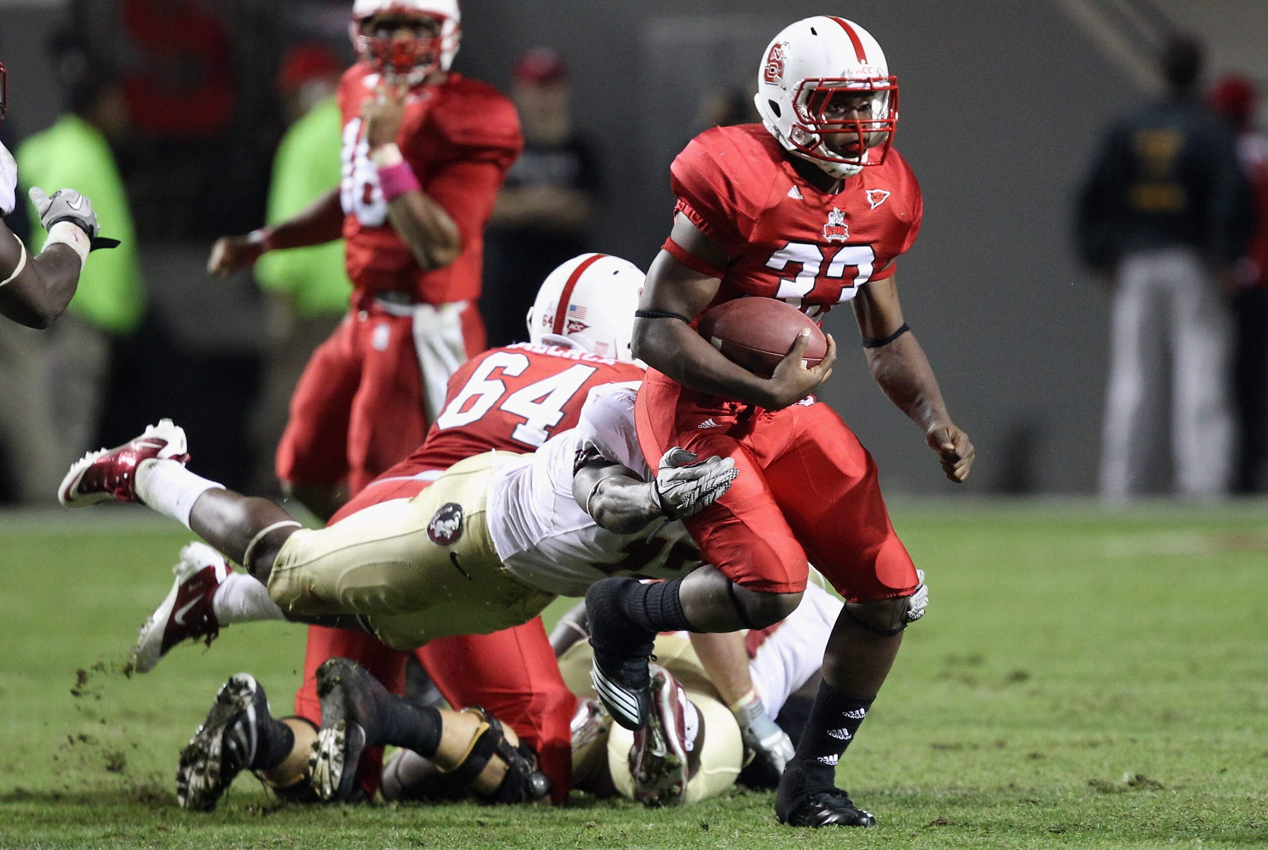 RALEIGH, NC - OCTOBER 28: Mustafa Greene #33 of the North Carolina State Wolfpack runs with the ball against the Florida State Seminoles during their game at Carter-Finley Stadium on October 28, 2010 in Raleigh, North Carolina. (Photo by Streeter Lecka/ RALEIGH, NC - OCTOBER 28: Mustafa Greene #33 of the North Carolina State Wolfpack runs with the ball against the Florida State Seminoles during their game at Carter-Finley Stadium on October 28, 2010 in Raleigh, North Carolina. (Photo by Streeter Lecka/