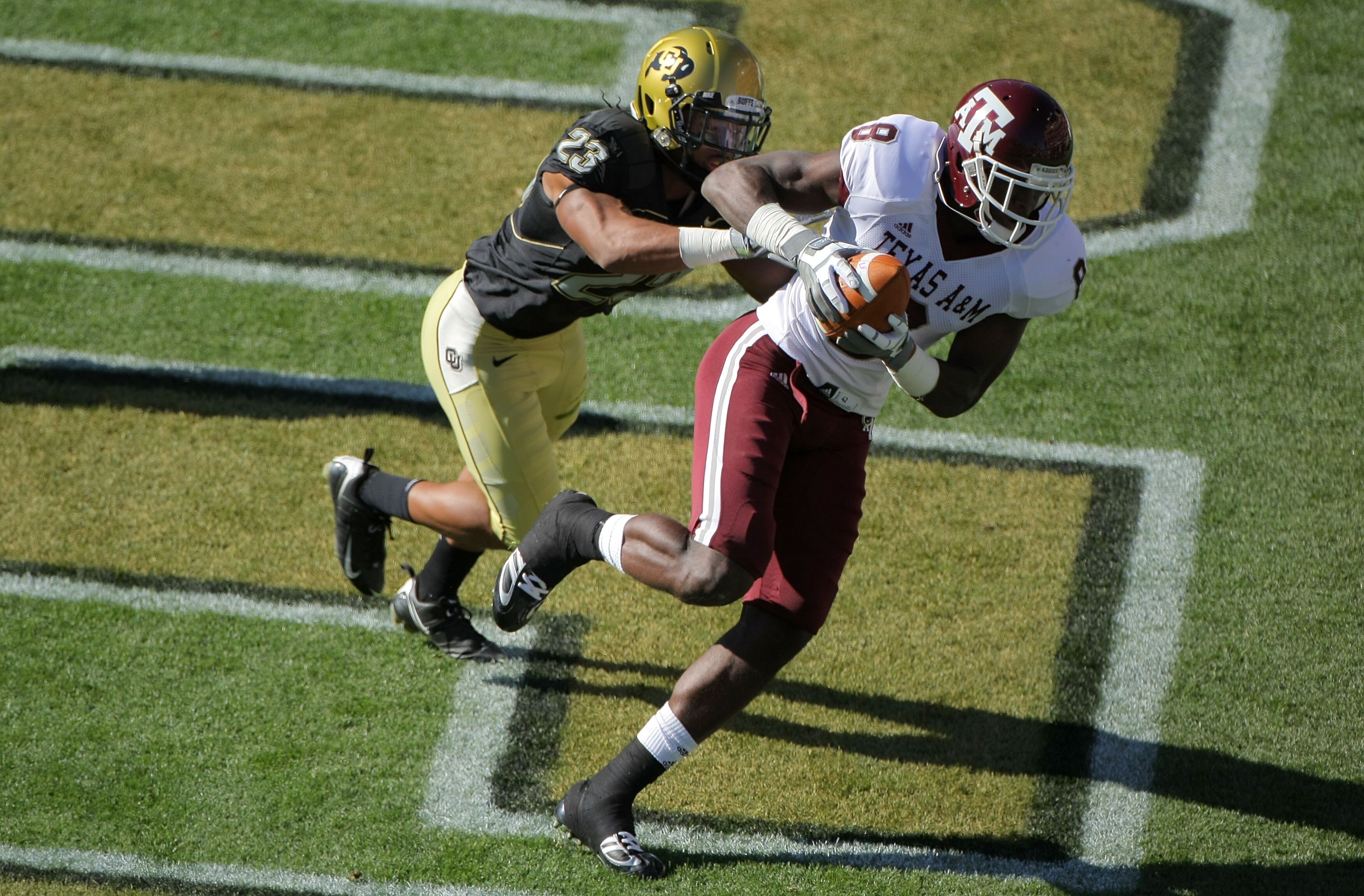 BOULDER, CO - NOVEMBER 07:  Jeff Fuller #8 of the Texas A&M Aggies catches a one yard touchdown pass against the defense of Jalil Brown #23 of the Colorado Buffaloes for the first score of the game in the first quarter during NCAA college football action