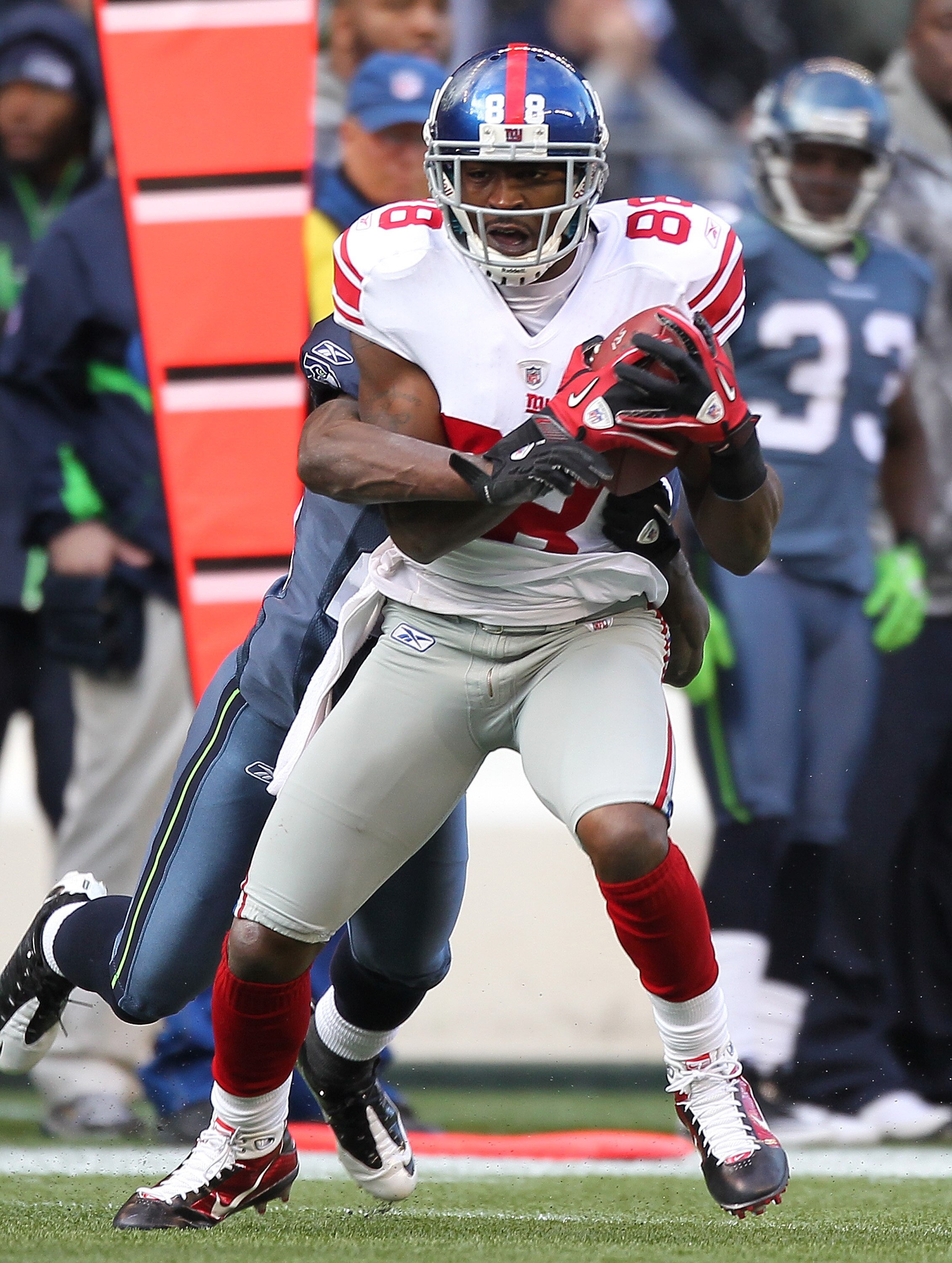 SEATTLE - NOVEMBER 07:  Wide receiver Hakeem Nicks #88 of the New York Giants rushes against Marcus Trufant #23 of the Seattle Seahawks at Qwest Field on November 7, 2010 in Seattle, Washington. The Giants defeated the Seahawks 41-7. (Photo by Otto Greule