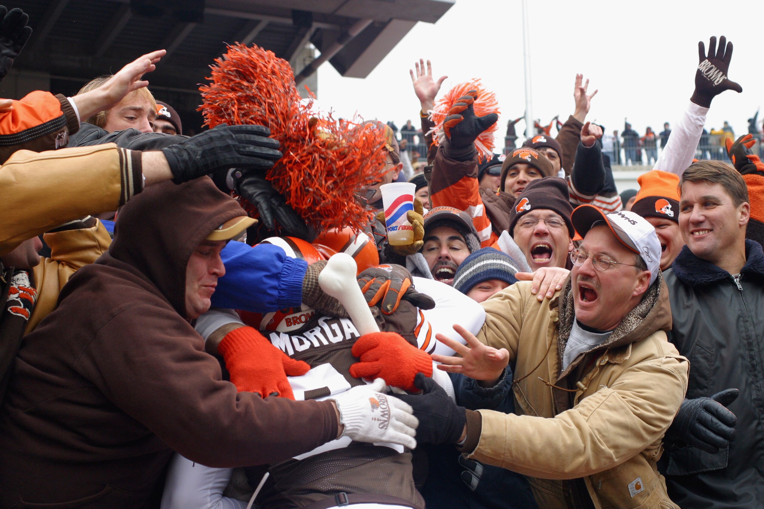 CLEVELAND - DECEMBER 15:  Wide receiver Quincy Morgan #81 of the Cleveland Browns celebrates his touchdown with the Dawg Pound during the game against the Indianapolis Colts at Cleveland Browns Stadium on December 15, 2002 in Cleveland, Ohio. The Colts wo