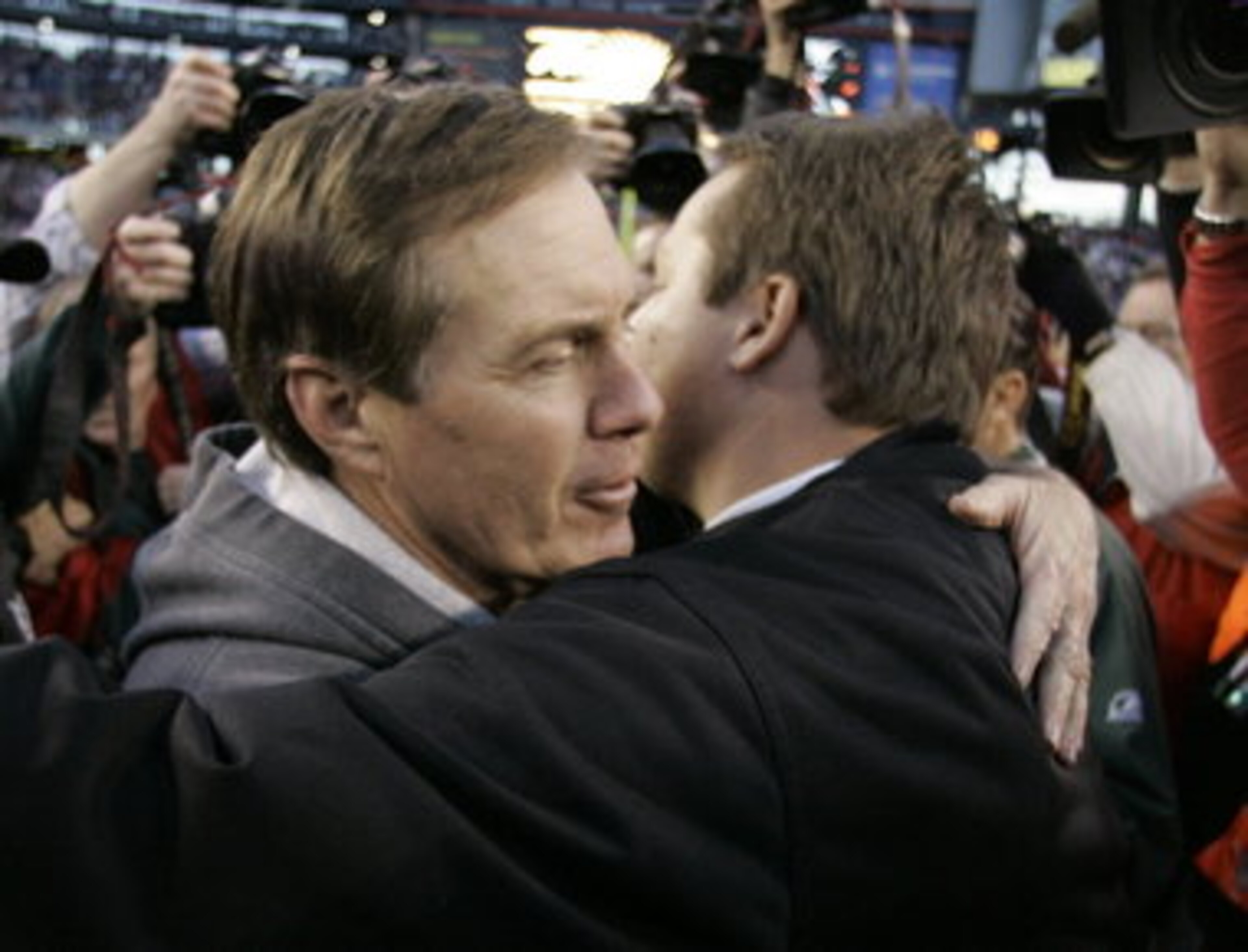 Eric Mangini "embracing" Bill Belichick. Really?