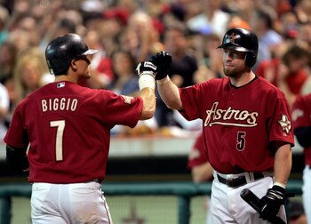HOUSTON - OCTOBER 10:  Craig Biggio #7 of the Houston Astros is congratulated by Jeff Bagwell #5 after hitting a home run against the Atlanta Braves during the second inning of game four of the National League Divisional Series on October 10, 2004 at Minu