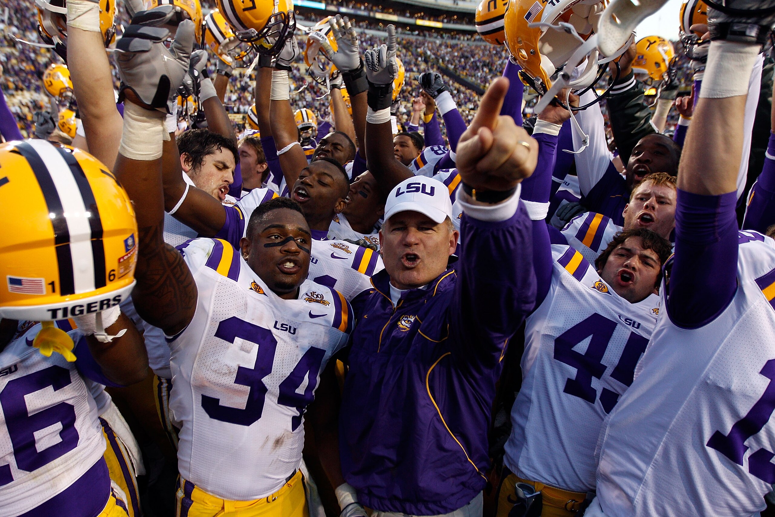BATON ROUGE, LA - NOVEMBER 06: Head coach Les Miles of the Louisiana State University Tigers celebrates with his team after defeating the Alabama Crimson Tide 24-21 at Tiger Stadium on November 6, 2010 in Baton Rouge, Louisiana. (Photo by Chris Graythen BATON ROUGE, LA - NOVEMBER 06: Head coach Les Miles of the Louisiana State University Tigers celebrates with his team after defeating the Alabama Crimson Tide 24-21 at Tiger Stadium on November 6, 2010 in Baton Rouge, Louisiana. (Photo by Chris Graythen