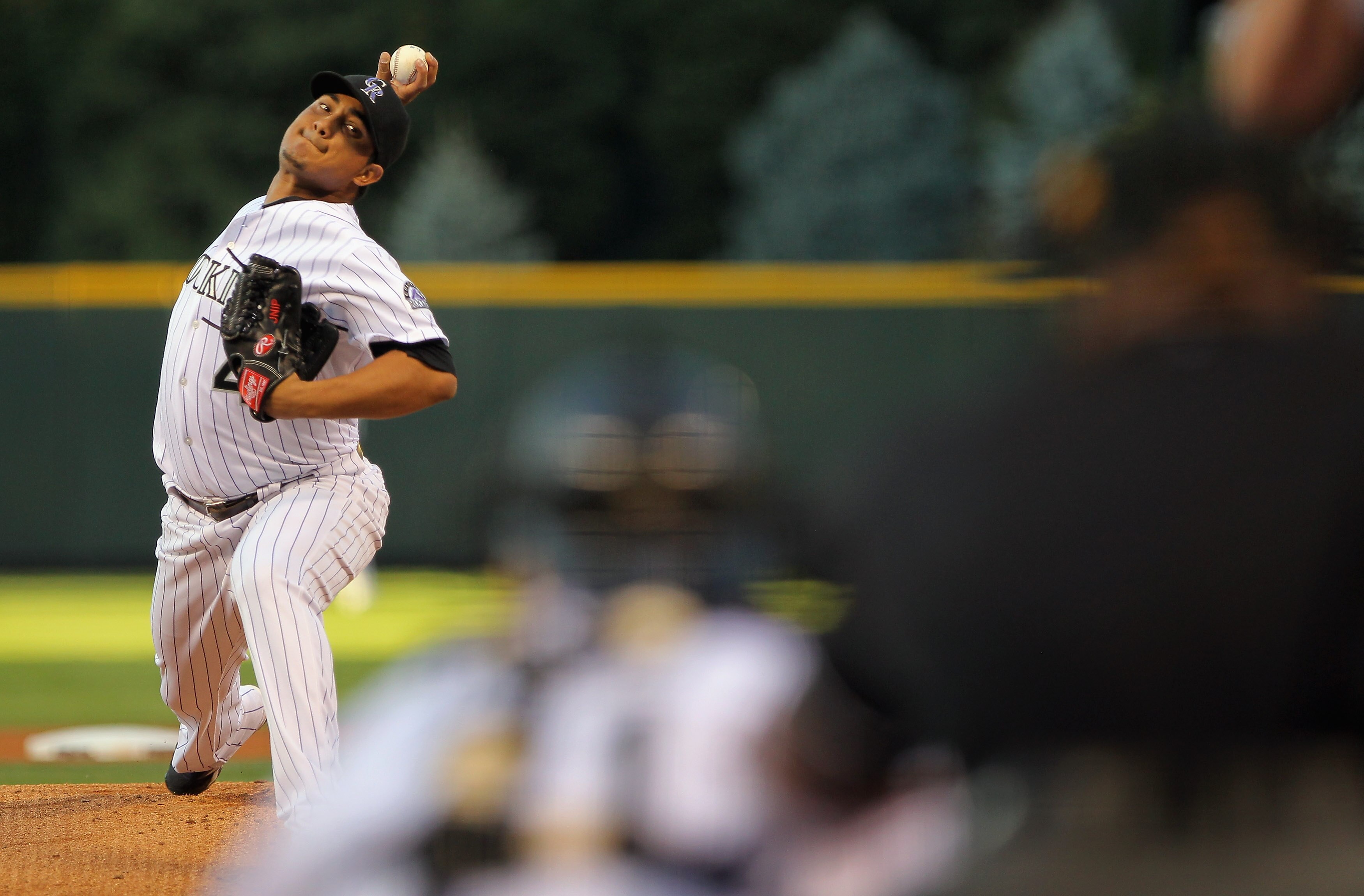 DENVER - SEPTEMBER 24:  Starting pitcher Jhoulys Chacin #45 of the Colorado Rockies delivers against the San Francisco Giants at Coors Field on September 24, 2010 in Denver, Colorado.  (Photo by Doug Pensinger/Getty Images)