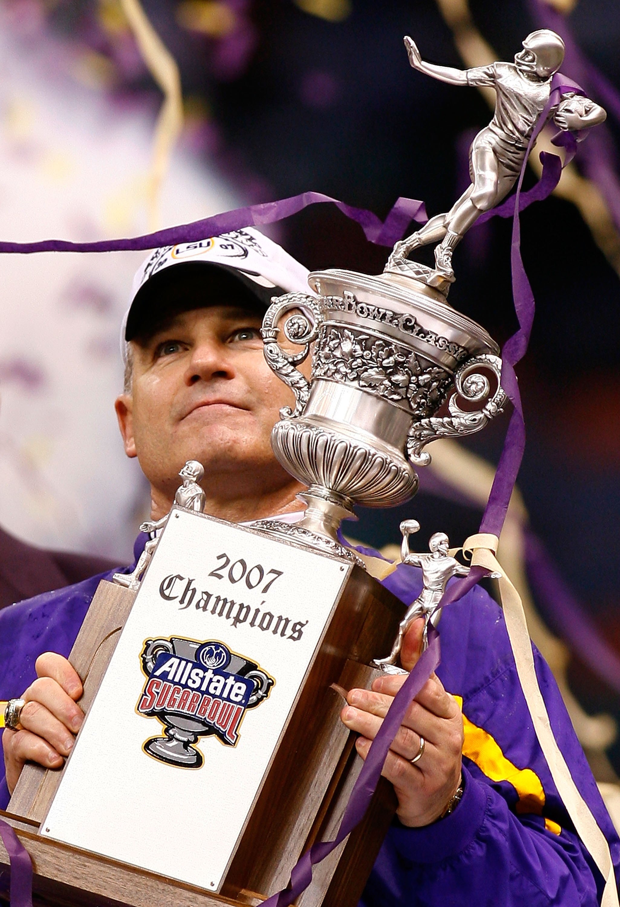 NEW ORLEANS - JANUARY 03:  Head coach Les Miles of the LSU Tigers holds up the Championship trophy after his team  defeated the Notre Dame Fighting Irish 41-14 in the 2007 Allstate Sugar Bowl on January 3, 2007 at the Superdome in New Orleans, Louisiana.