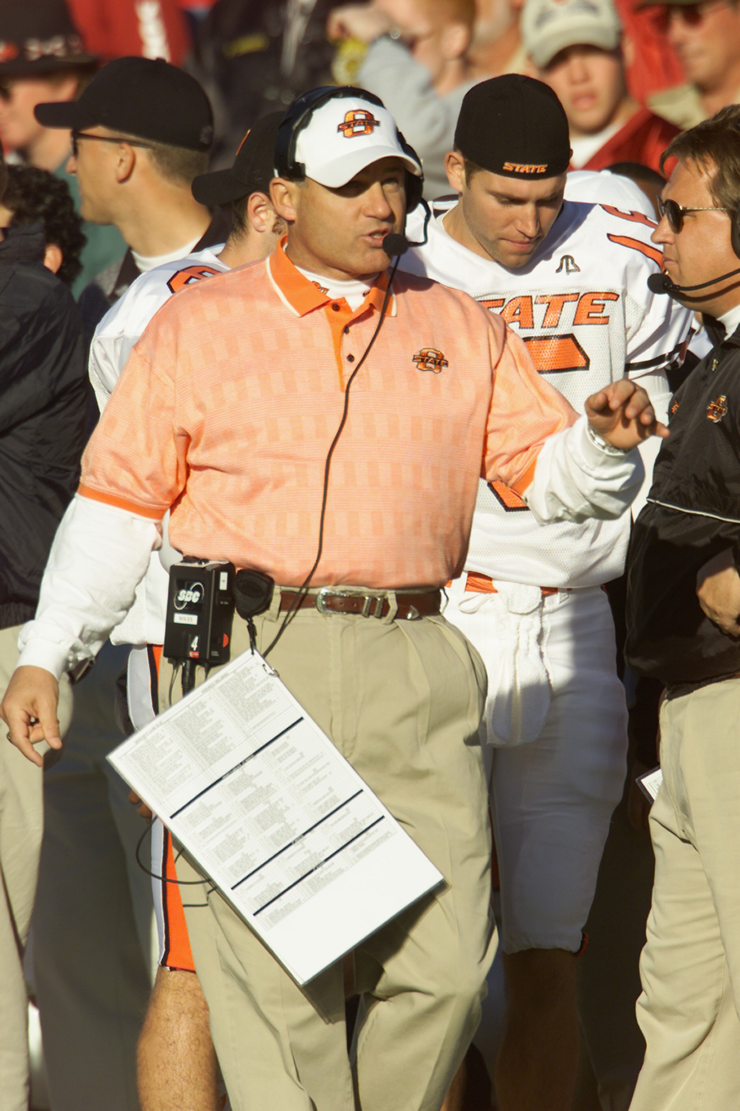 NORMAN, OK - NOVEMBER 24: Head Coach Les Miles of the Oklahoma State Cowboys stands on the sideline against the Oklahoma Sooners in the second quarter of the game on November 24, 2001 at Owen Field in Norman, Oklahoma. Oklahoma State upset Oklahoma 16-1 NORMAN, OK - NOVEMBER 24: Head Coach Les Miles of the Oklahoma State Cowboys stands on the sideline against the Oklahoma Sooners in the second quarter of the game on November 24, 2001 at Owen Field in Norman, Oklahoma. Oklahoma State upset Oklahoma 16-1