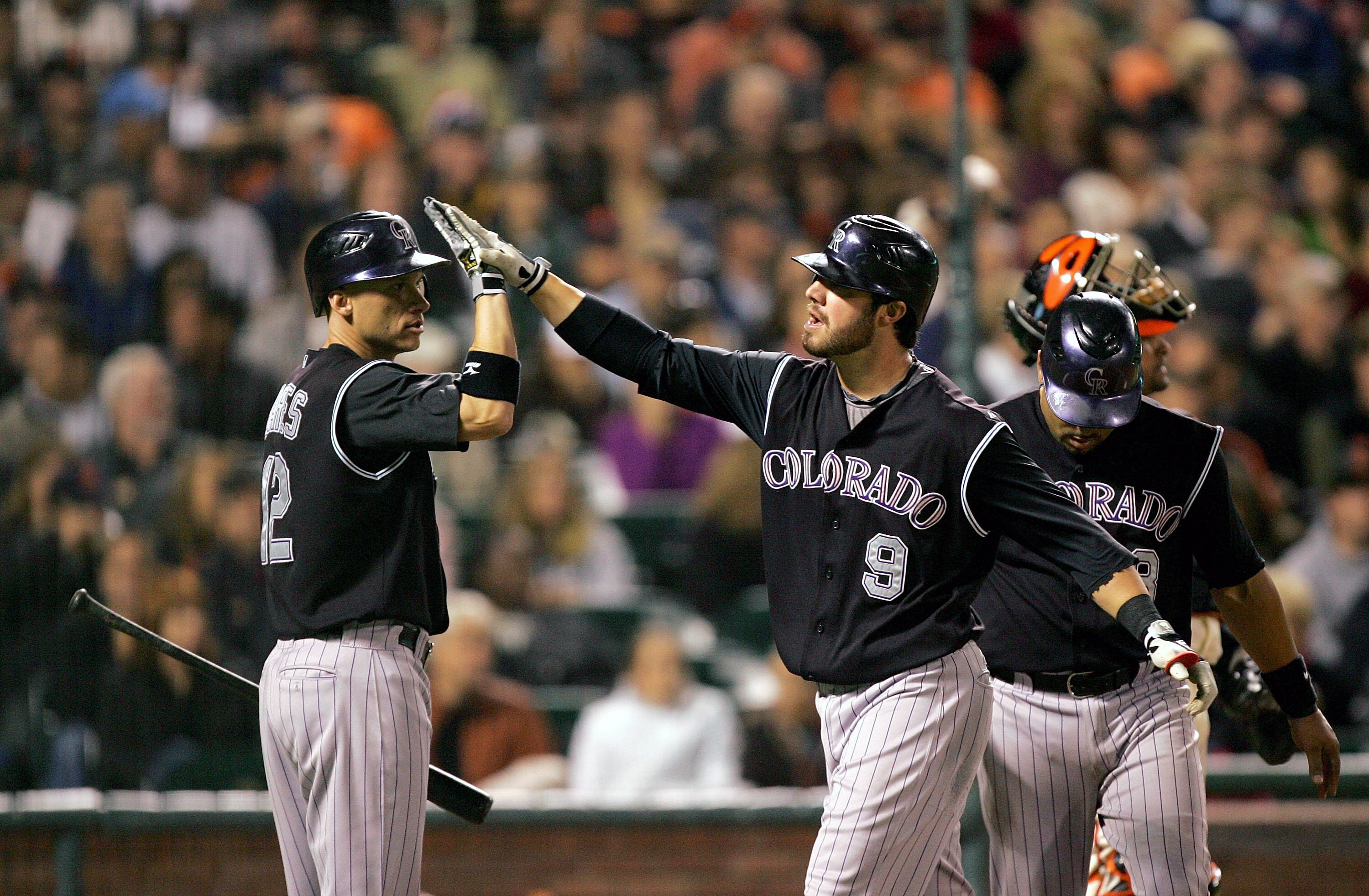 SAN FRANCISCO - SEPTEMBER 16:  Ian Stewart #9 of the Colorado Rockies is congratulated by Clint Barmes #12 after he hit a two-run home run to give the Rockies a 4-0 lead over the San Francisco Giants in the sixth inning of their game at AT&T Park on Septe