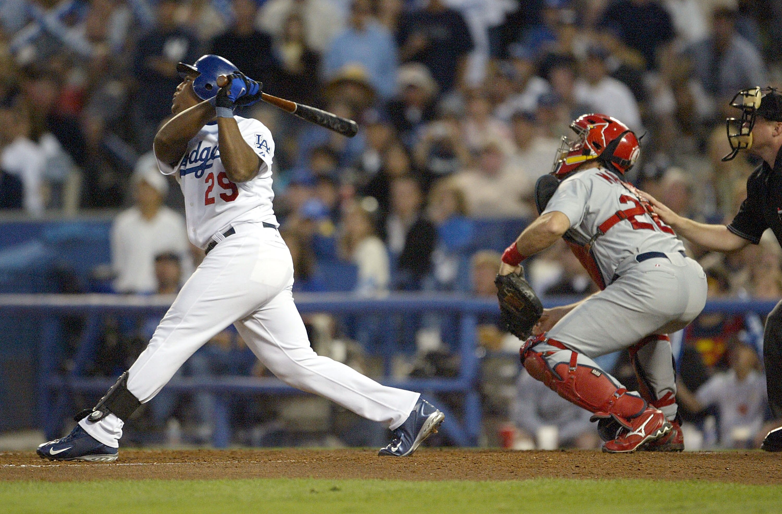 LOS ANGELES - OCTOBER 10:  Adrian Beltre #29 of the Los Angeles Dodgers hits a sacrifice fly that allowed Jayson Werth #28 to score in the third inning of the National League Division Series, Game Four on October 10, 2004 at Dodger Stadium in Los Angeles,