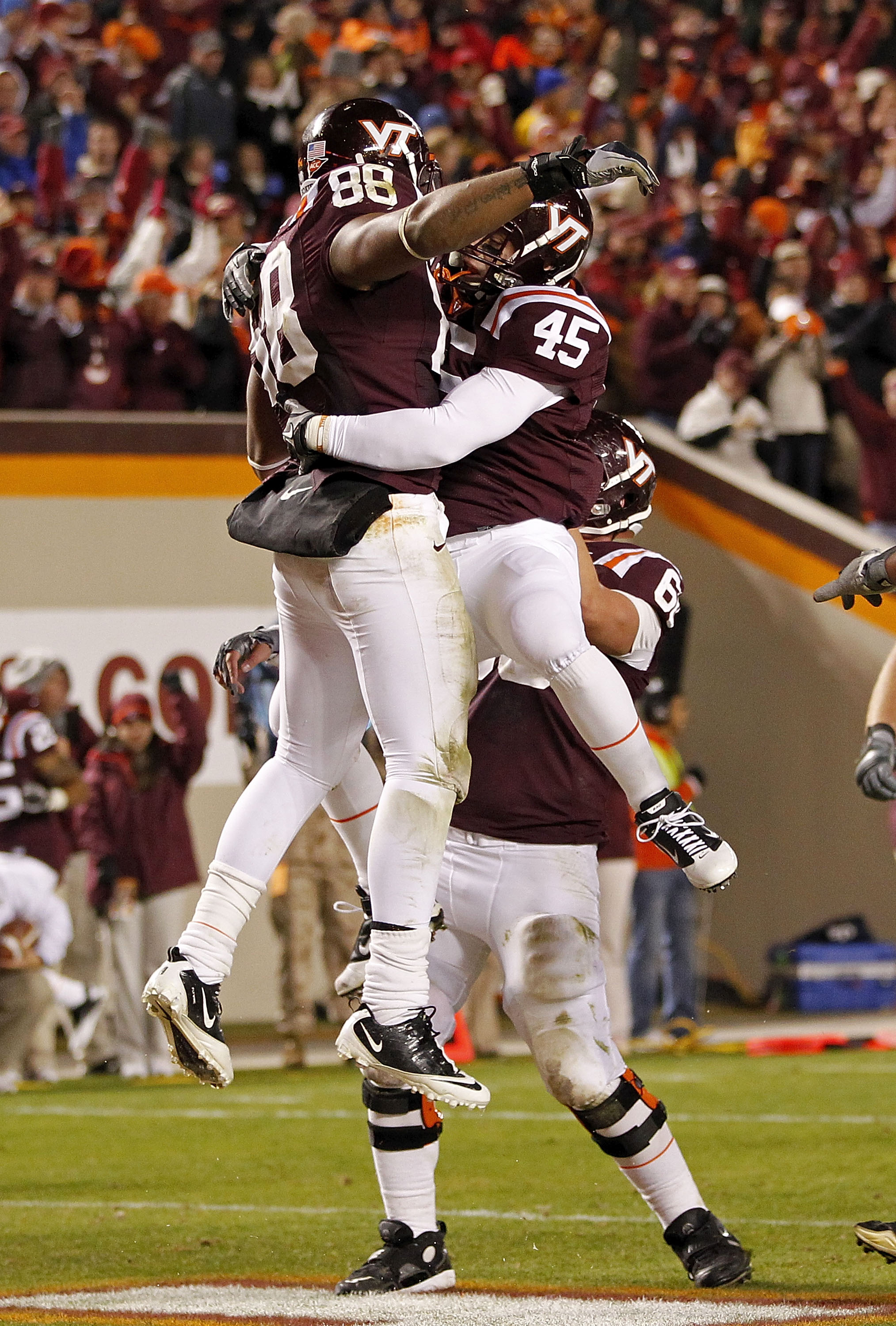 BLACKSBURG, VA - NOVEMBER 04: Tight end Andre Smith #88 of the Virginia Tech Hokies celebrates after catching a touchdown pass against the Georgia Tech Yellow Jackets with fullback Joey Phillips #45 of the Virginia Tech Hokies at Lane Stadium on November