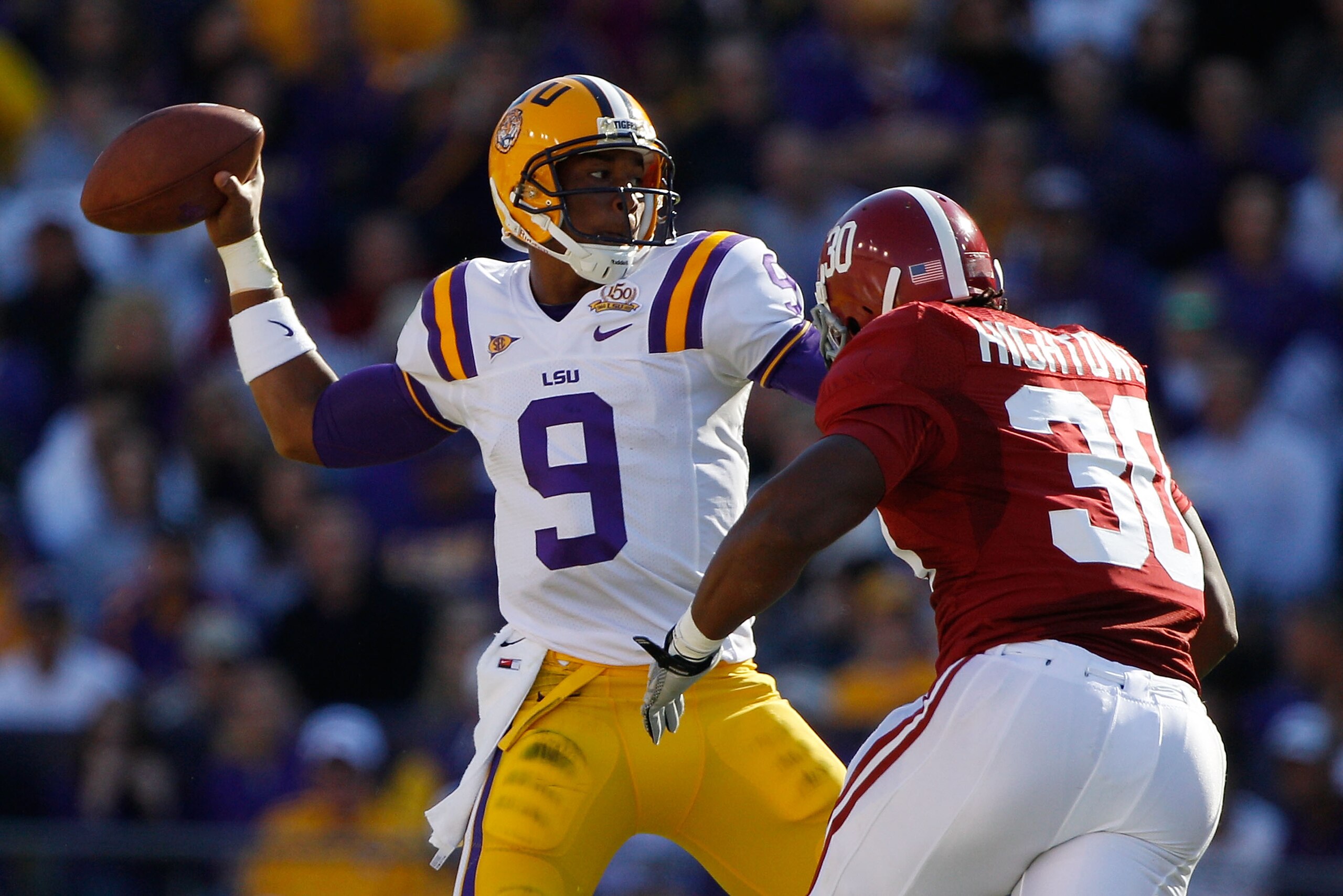 BATON ROUGE, LA - NOVEMBER 06:  Jordan Jefferson #9 of the Louisiana State University Tigers throws under pressure from Dont'a Hightower #30 of the Alabama Crimson Tide  at Tiger Stadium on November 6, 2010 in Baton Rouge, Louisiana.  (Photo by Chris Gray