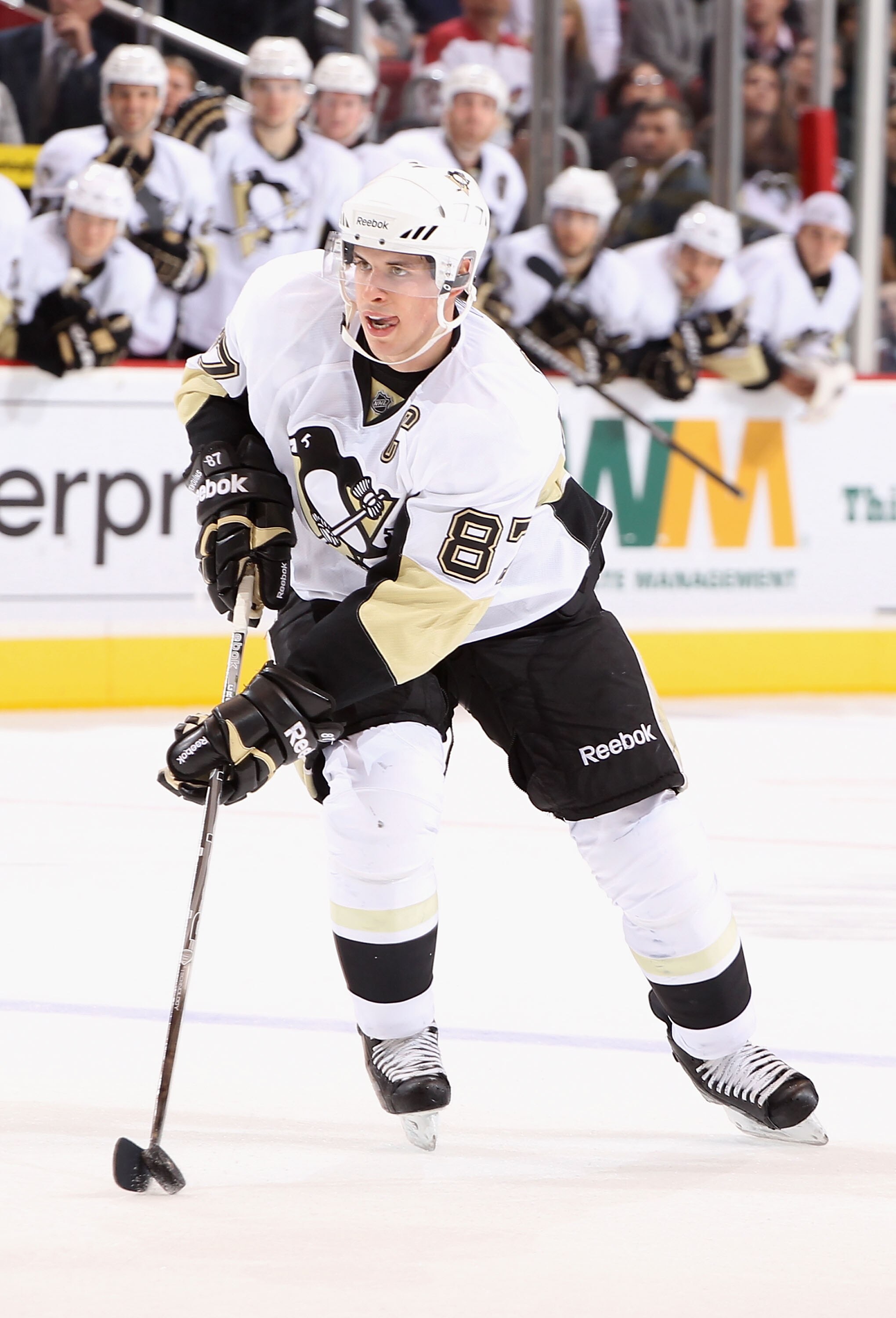 GLENDALE, AZ - NOVEMBER 06:  Sidney Crosby #87 of the Pittsburgh Penguins skates with the puck during the NHL game against the Phoenix Coyotes at Jobing.com Arena on November 6, 2010 in Glendale, Arizona. The Penguins defeated the Coyotes 4-3 in an overti