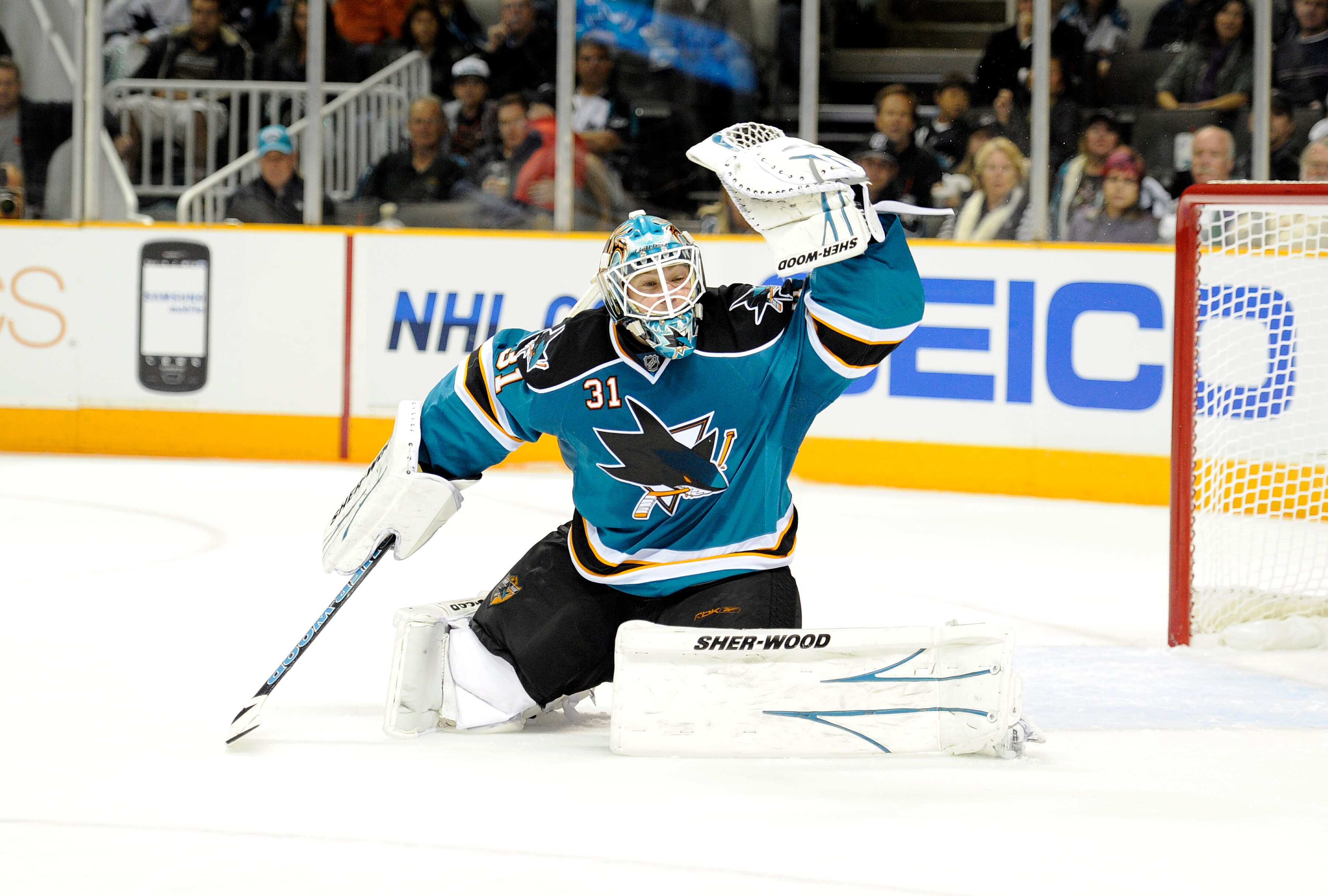 SAN JOSE, CA - OCTOBER 16: Goalie Antti Niemi #31 of the San Jose Sharks glove save a shot against the Atlanta Thrashers from going into the goal at the HP Pavilion October 16, 2010 in San Jose, California. (Photo by Thearon W. Henderson/Getty Images)