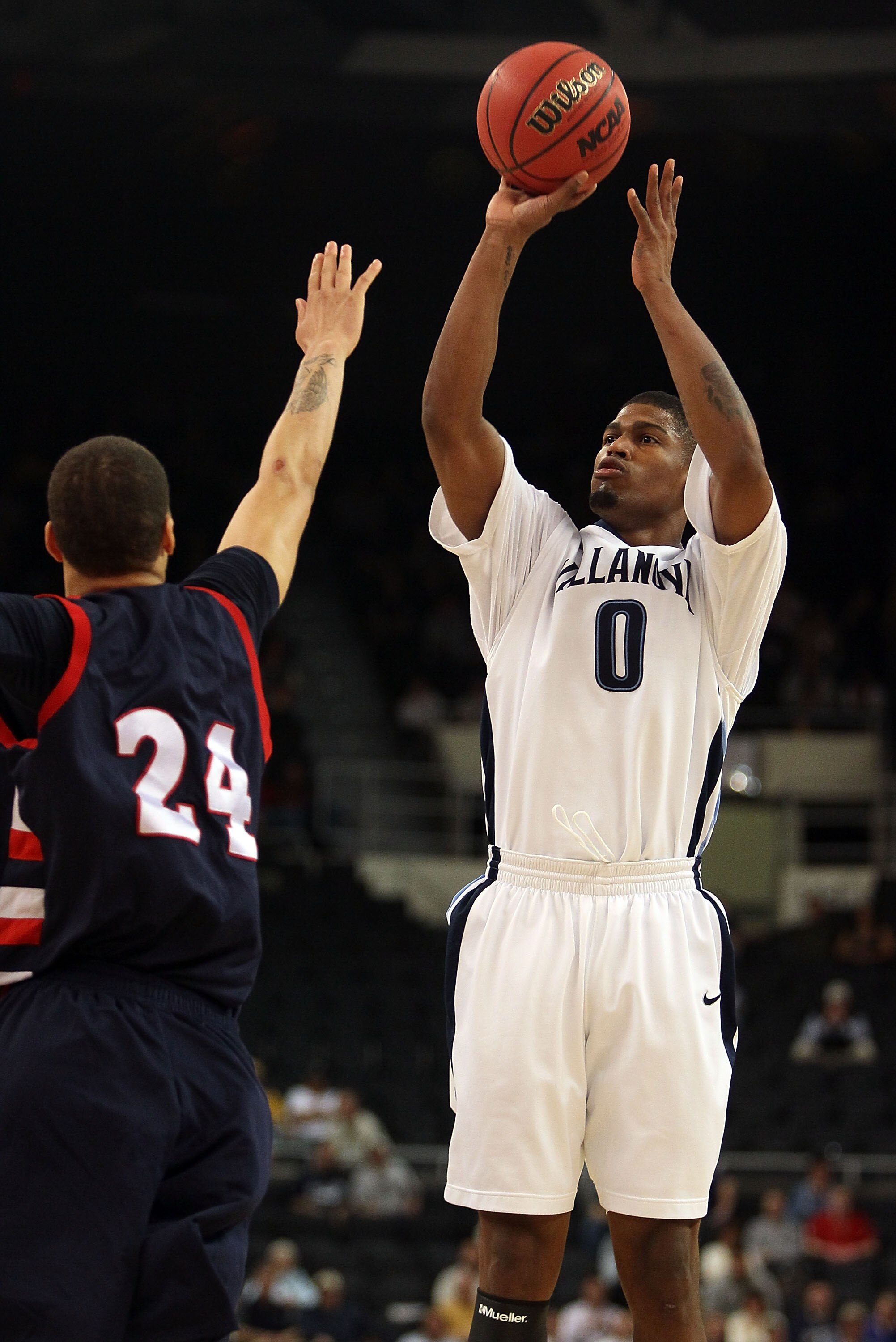 PROVIDENCE, RI - MARCH 18:  Antonio Pena #0 of the Villanova Wildcats takes a shot as Dallas Green #24 of the Robert Morris Colonials defends during the first round of the 2010 NCAA men's basketball tournament on March 18, 2010 at the Dunkin Donuts Arena 