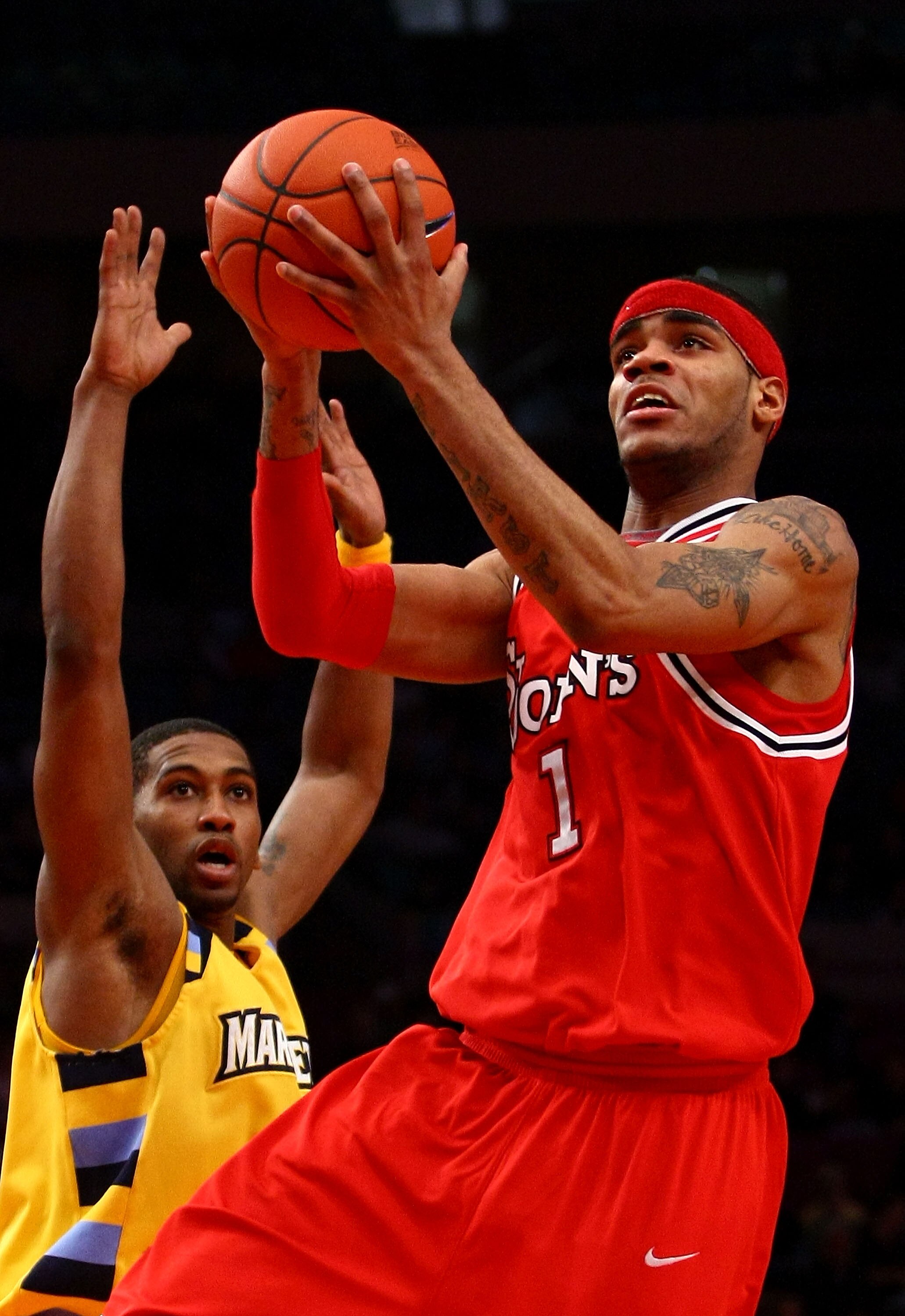 NEW YORK - MARCH 11: D.J. Kennedy #1 of the St. John's Red Storm drives to the hoop against the Marquette Golden Eagles during the second round of the Big East Tournament at Madison Square Garden on March 11, 2009 in New York City.  (Photo by Chris McGrat