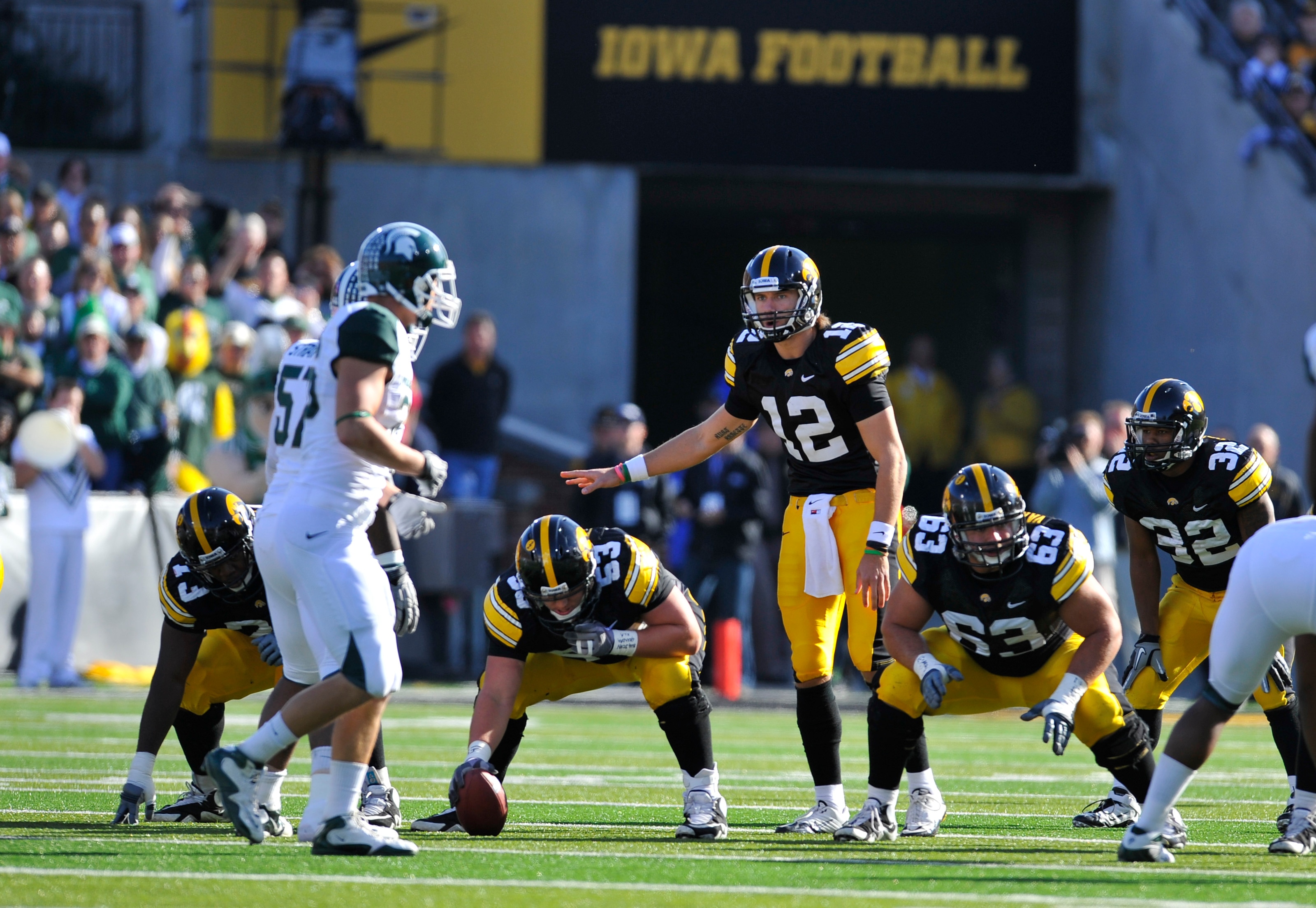 IOWA CITY, IA - OCTOBER 30- Quarterback Ricky Stanzi #12 of the University of Iowa Hawkeyes calls out a play at the line of scrimmage during play against the Michigan State Spartans at Kinnick Stadium on October 30, 2010 in Iowa City, Iowa. Iowa won 37-6
