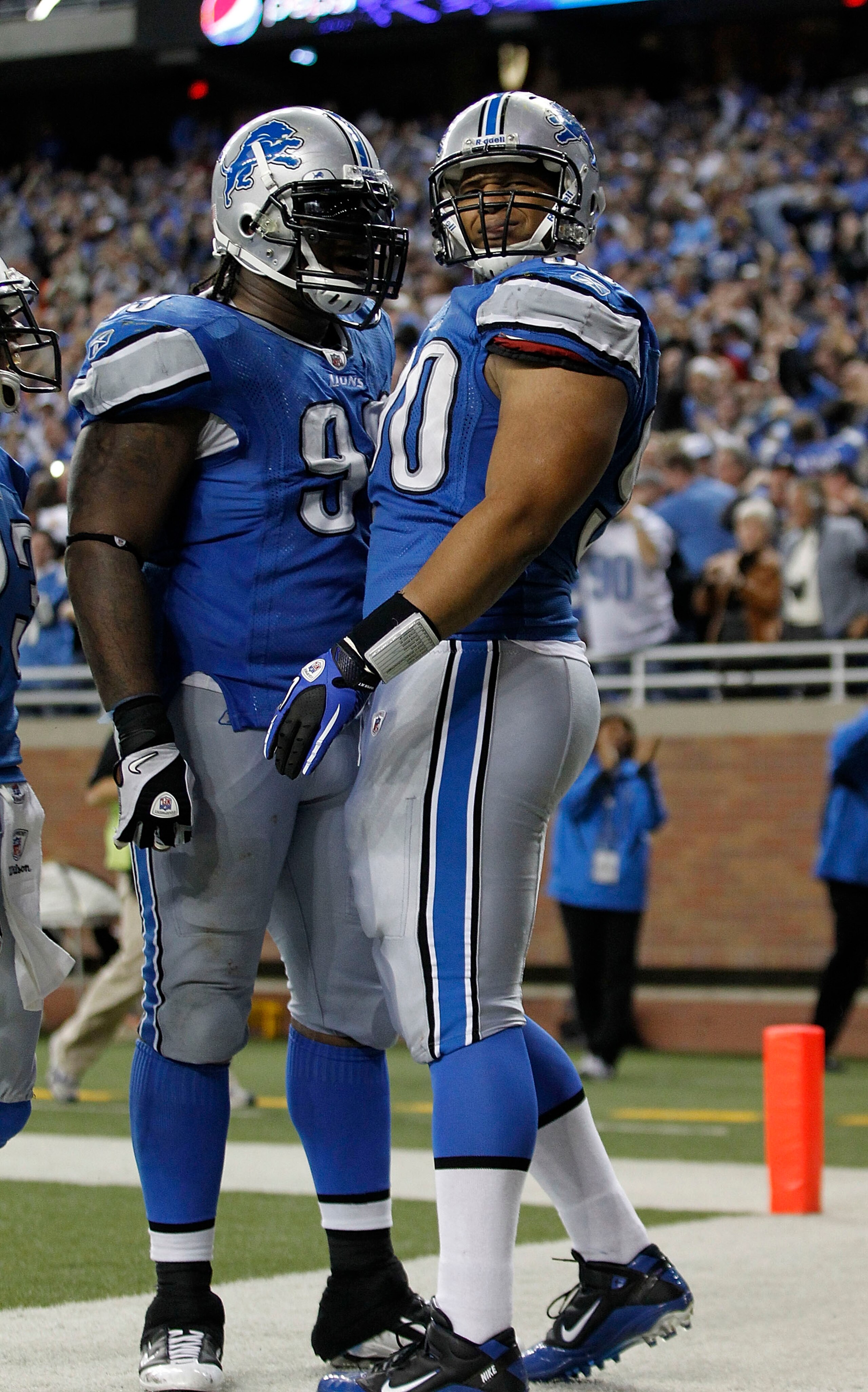 DETROIT - OCTOBER 31: Ndamukong Suh #90 of the Detroit Lions celebrates with teammate Corey Williams #99 after recovering a late fourth quarter fumble from Rex Grossman #8 of the Washington Redskins an scores a touchdown at Ford Field on October 31, 2010 DETROIT - OCTOBER 31: Ndamukong Suh #90 of the Detroit Lions celebrates with teammate Corey Williams #99 after recovering a late fourth quarter fumble from Rex Grossman #8 of the Washington Redskins an scores a touchdown at Ford Field on October 31, 2010