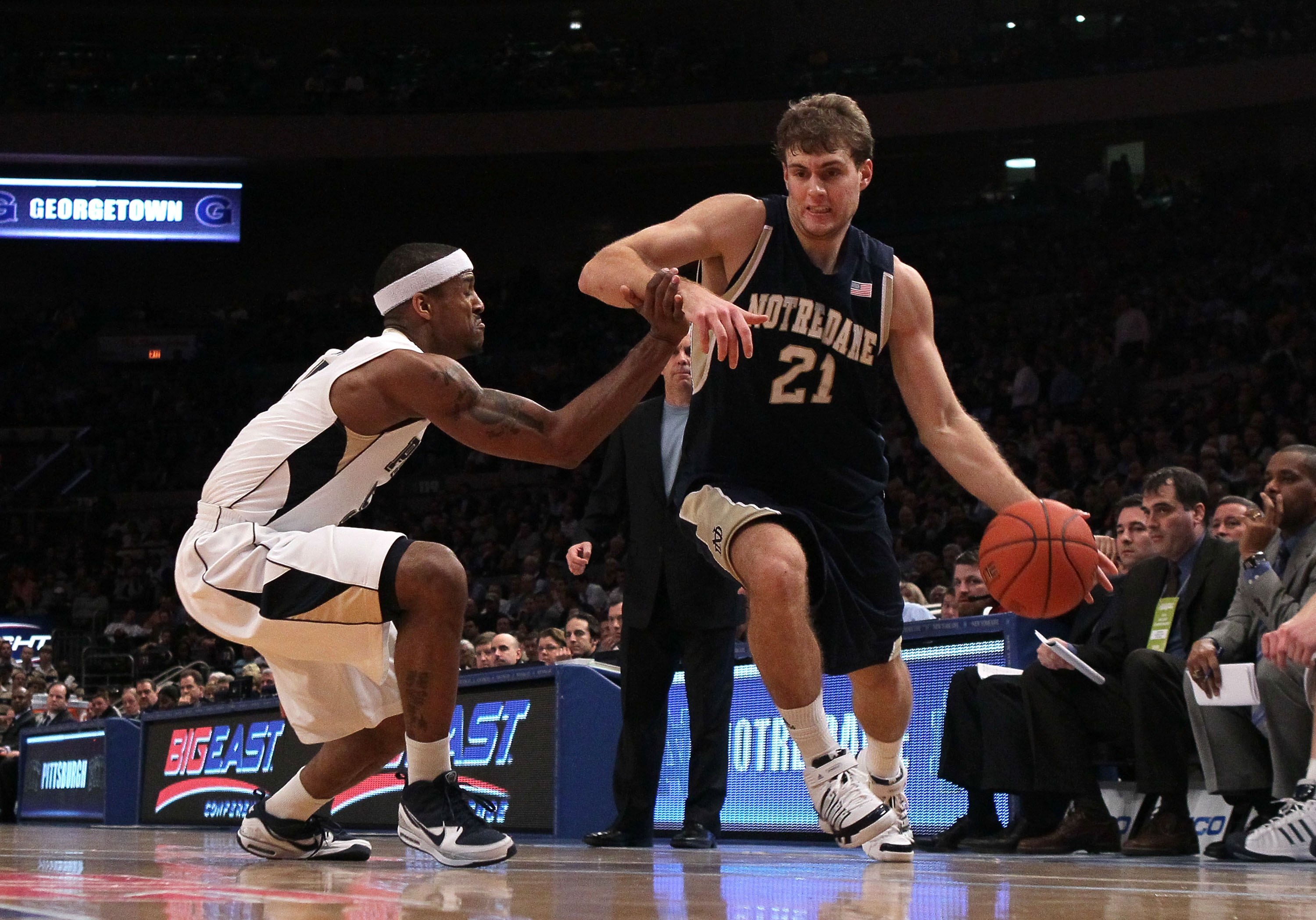 NEW YORK - MARCH 11:  Tim Abromaitis #21 of the Notre Dame Fighting Irish handles the ball against Gilbert Brown #5 of the Pittsburgh Panthers during the quarterfinal of the 2010 NCAA Big East Tournament at Madison Square Garden on March 11, 2010 in New Y
