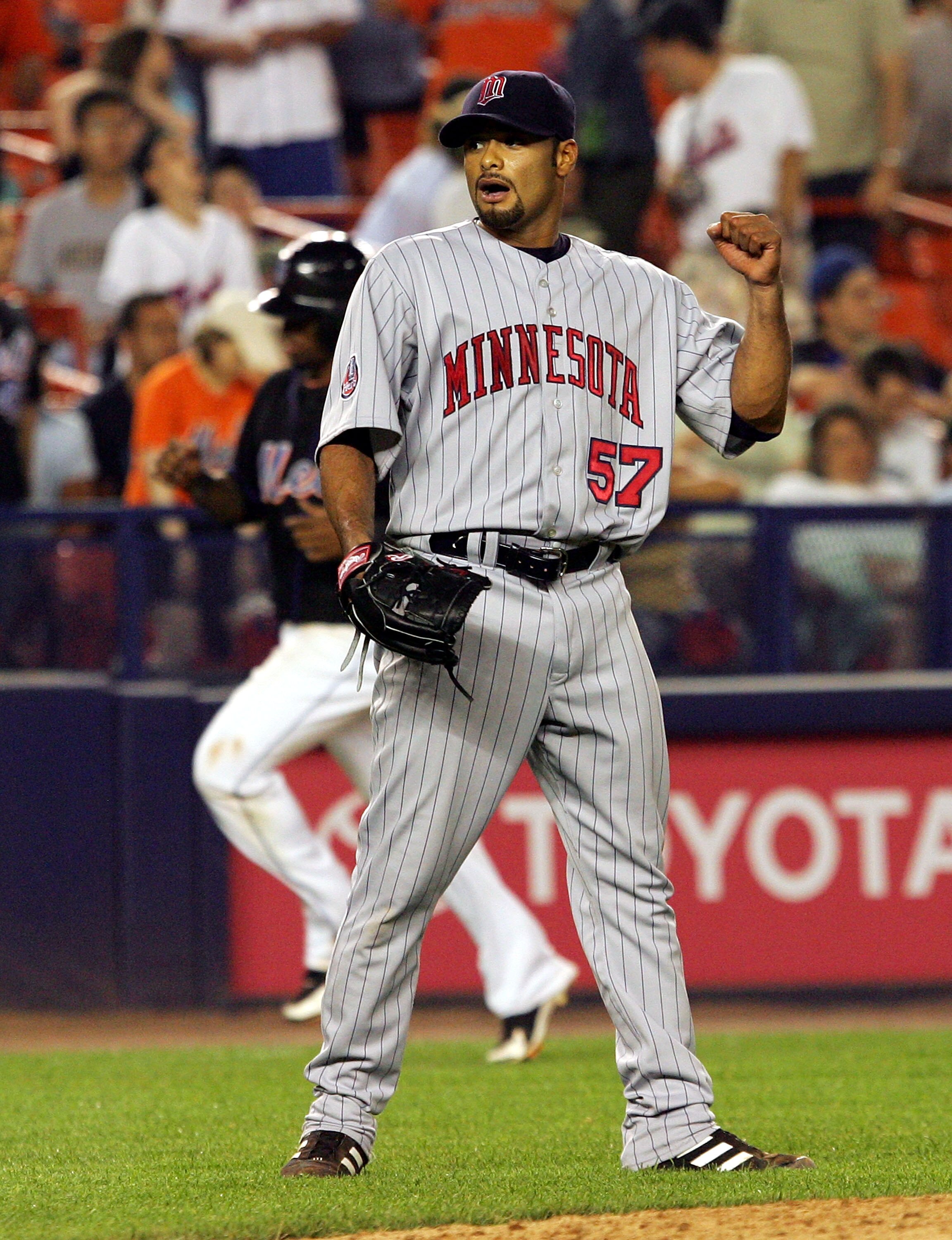 NEW YORK - JUNE 19:  Johan Santana #57 of the Minnesota Twins celebrates his 92 pitch complete game shutout against the New York Mets during their interleague game on June 19, 2007 at Shea Stadium in the Flushing neighborhood of the Queens borough of New