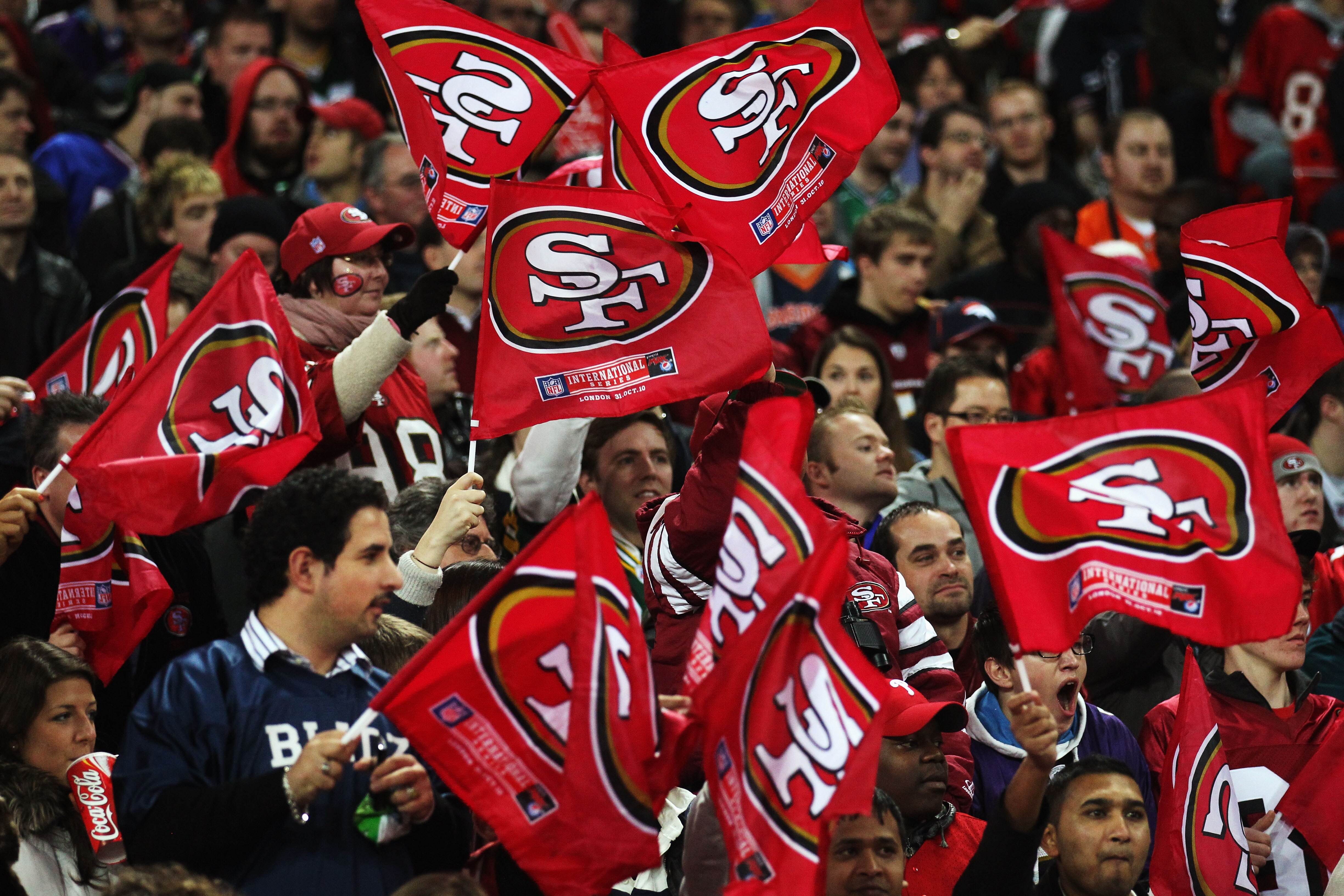 LONDON, ENGLAND - OCTOBER 31:  San Francisco 49ers fans waves flags in support of their team during the NFL International Series match between Denver Broncos and San Francisco 49ers at Wembley Stadium on October 31, 2010 in London, England. This is the fo