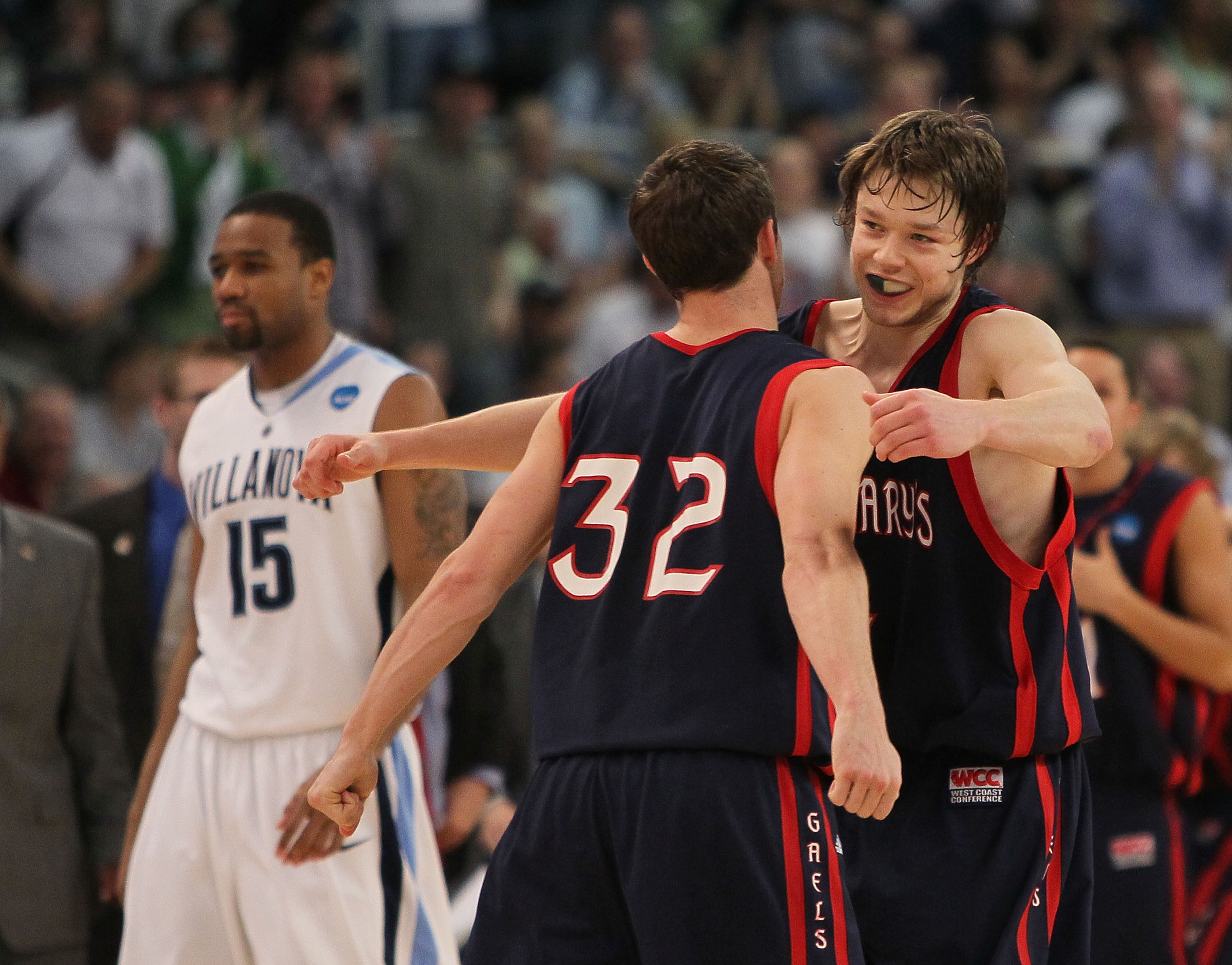 PROVIDENCE, RI - MARCH 20: Mickey McConnell #32 is hugged by Matthew Dellavedova #4 of the Saint Mary's Gaels after a win as Reggie Redding #15 of the Villanova Wildcats leaves the court during the second round of the 2010 NCAA men's tournament at Dunkin PROVIDENCE, RI - MARCH 20: Mickey McConnell #32 is hugged by Matthew Dellavedova #4 of the Saint Mary's Gaels after a win as Reggie Redding #15 of the Villanova Wildcats leaves the court during the second round of the 2010 NCAA men's tournament at Dunkin