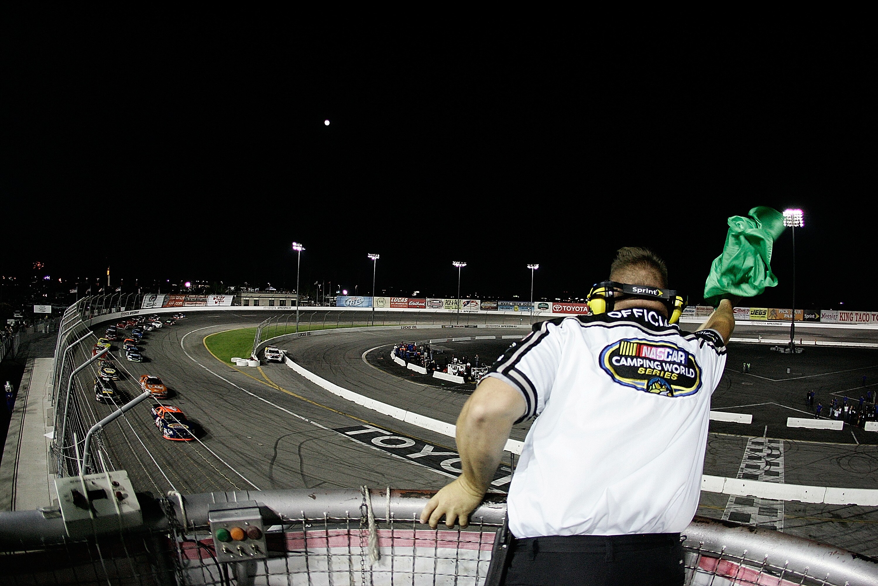 IRWINDALE, CA - JULY 4: An official waves the green flag to start the NASCAR Camping World Series West King Taco 200 race at the Toyota Speedway on July 4, 2009 in Irwindale, California. (Photo by Kevin Terrell/Getty Images for NASCAR)