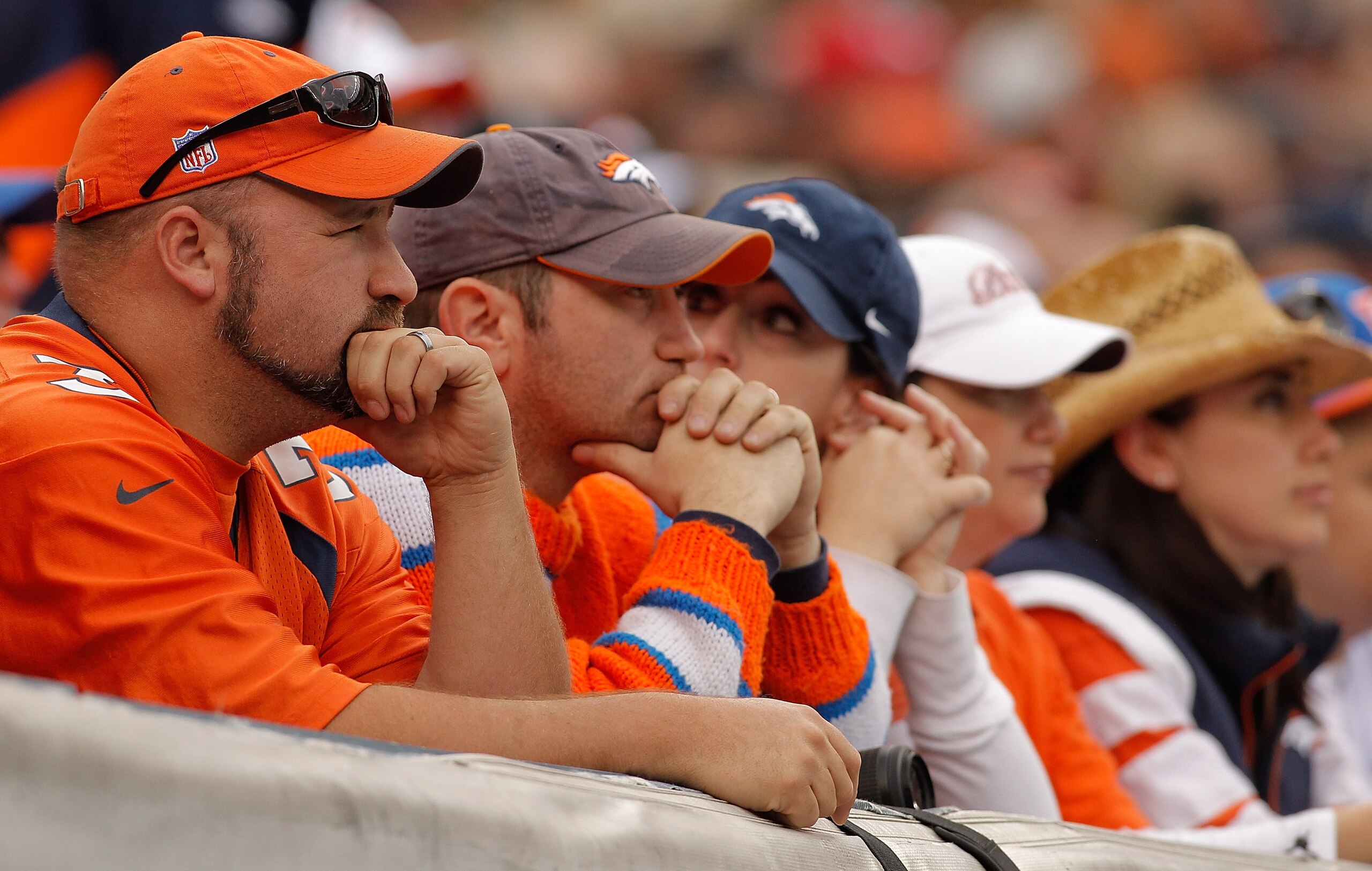 DENVER - OCTOBER 24:  Fans of the Denver Broncos look on during the second quarter against the Oakland Raiders at INVESCO Field at Mile High on October 24, 2010 in Denver, Colorado. (Photo by Justin Edmonds/Getty Images)