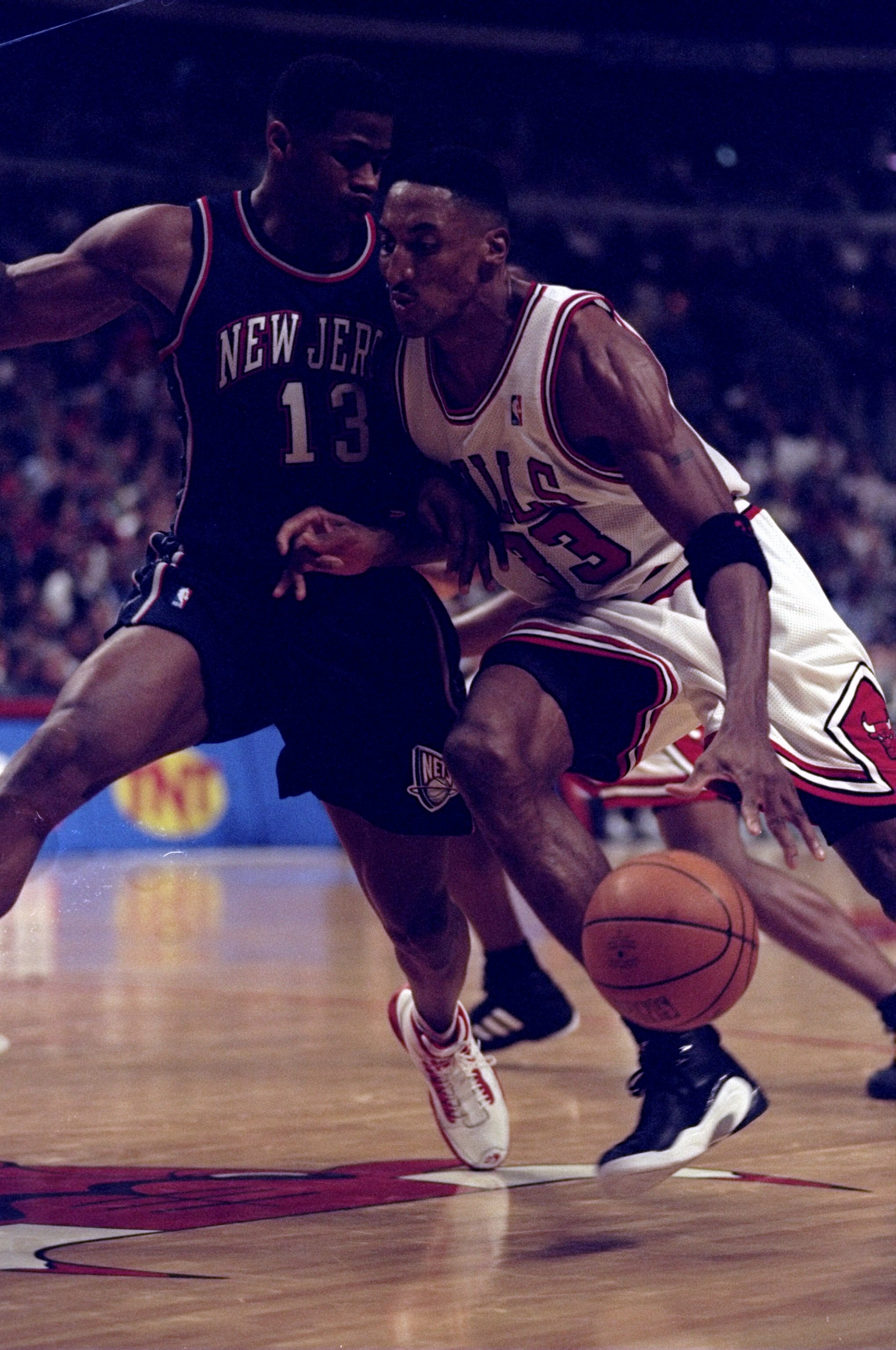 24 Apr 1998: Guard Scottie Pippen of the Chicago Bulls in action against guard Kendall Gill of the New Jersey Nets during a game at the United Center in Chicago, Illinois. The Bulls defeated the Nets 96-93.