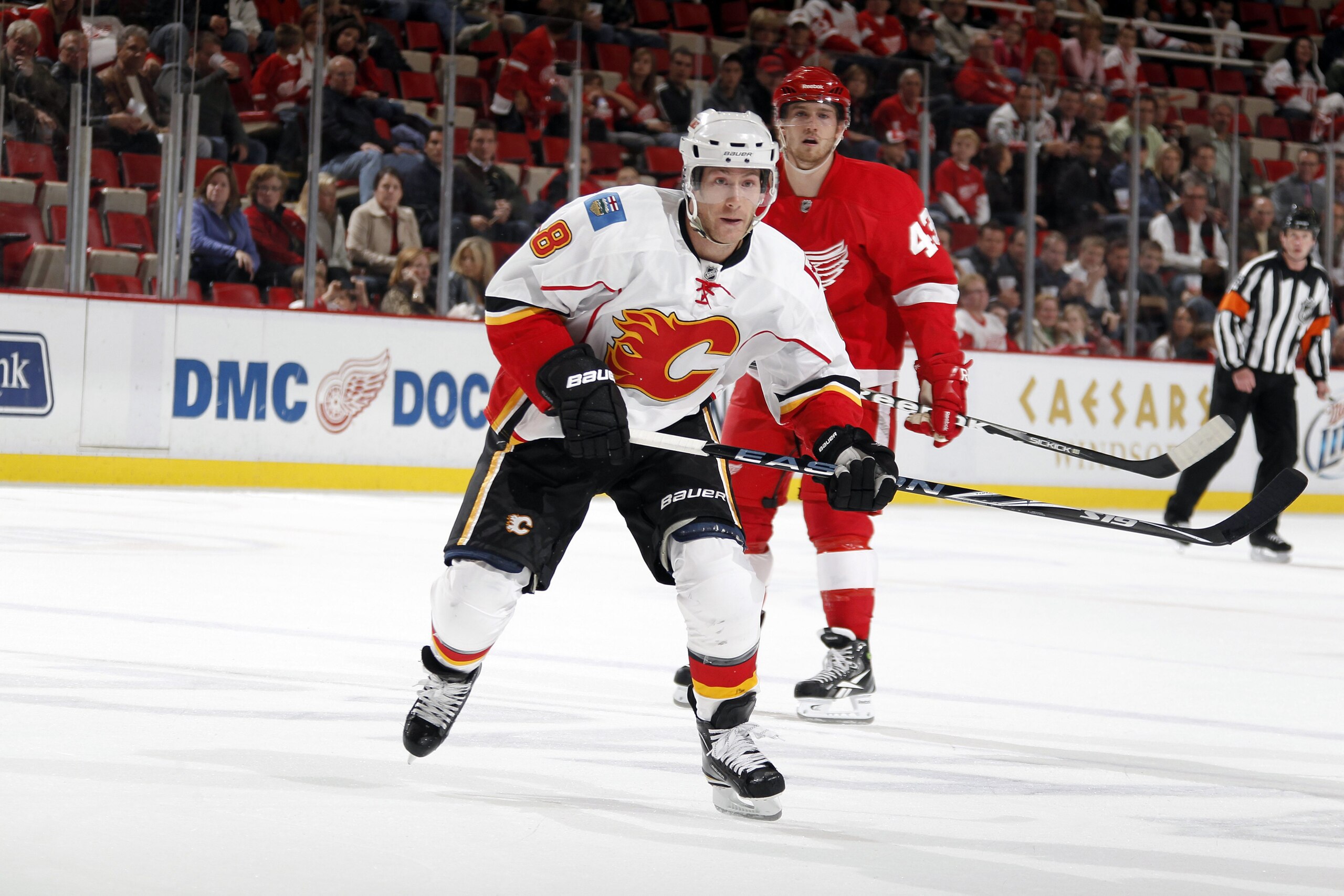 DETROIT - OCTOBER 21:  Brendan Morrison #8 of the Calgary Flames skates during a game against the Detroit Red Wings on October 21, 2010 at the Joe Louis Arena in Detroit, Michigan.  (Photo by Gregory Shamus/Getty Images)
