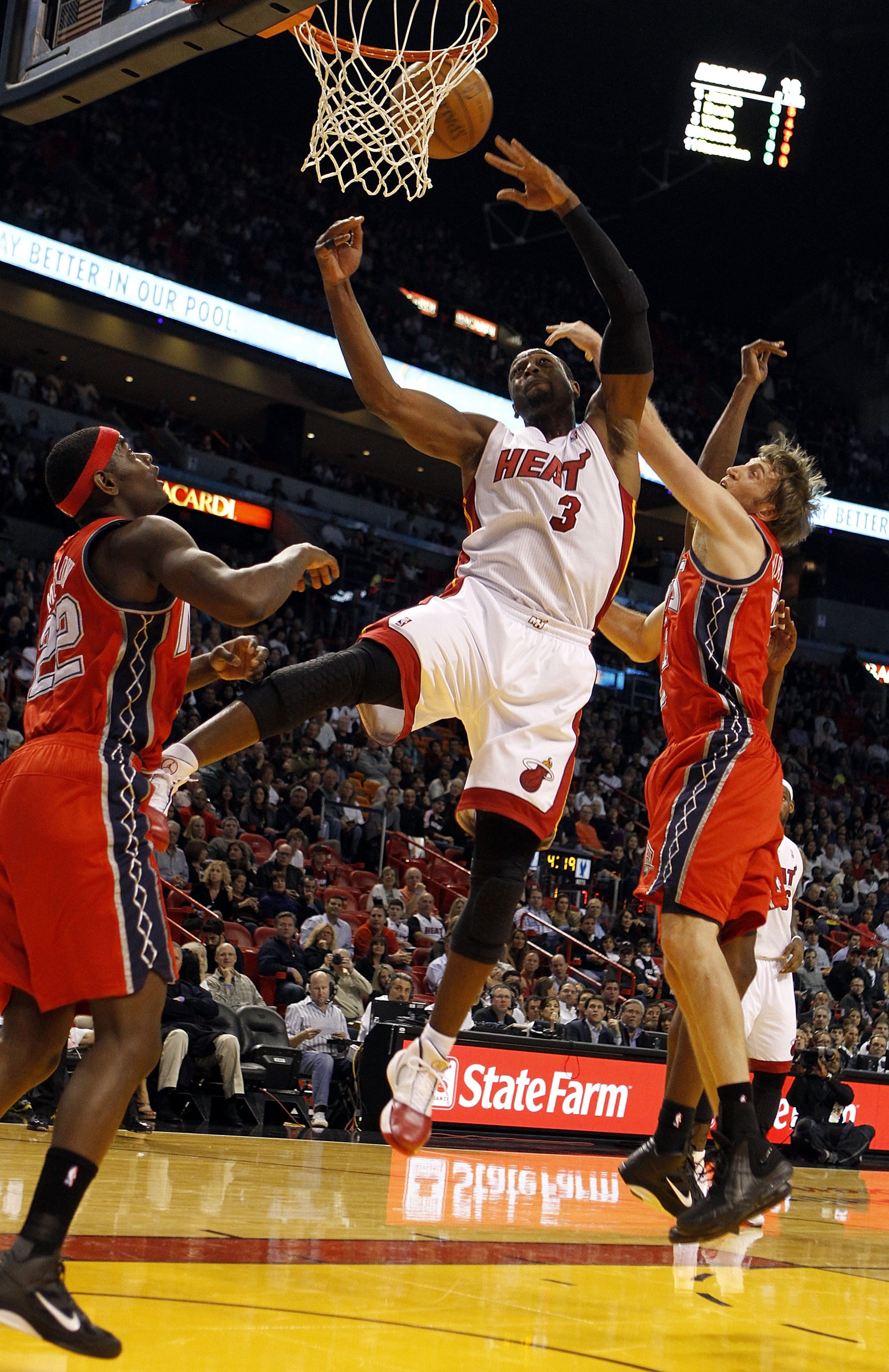 MIAMI - NOVEMBER 06: Guard Dwyane Wade #3 of the Miami Heat passes against gueard Anthony Morrow #22 of the New Jersey Nets at American Airlines Arena on November 6, 2010 in Miami, Florida. NOTE TO USER: User expressly acknowledges and agrees that, by d MIAMI - NOVEMBER 06: Guard Dwyane Wade #3 of the Miami Heat passes against gueard Anthony Morrow #22 of the New Jersey Nets at American Airlines Arena on November 6, 2010 in Miami, Florida. NOTE TO USER: User expressly acknowledges and agrees that, by d
