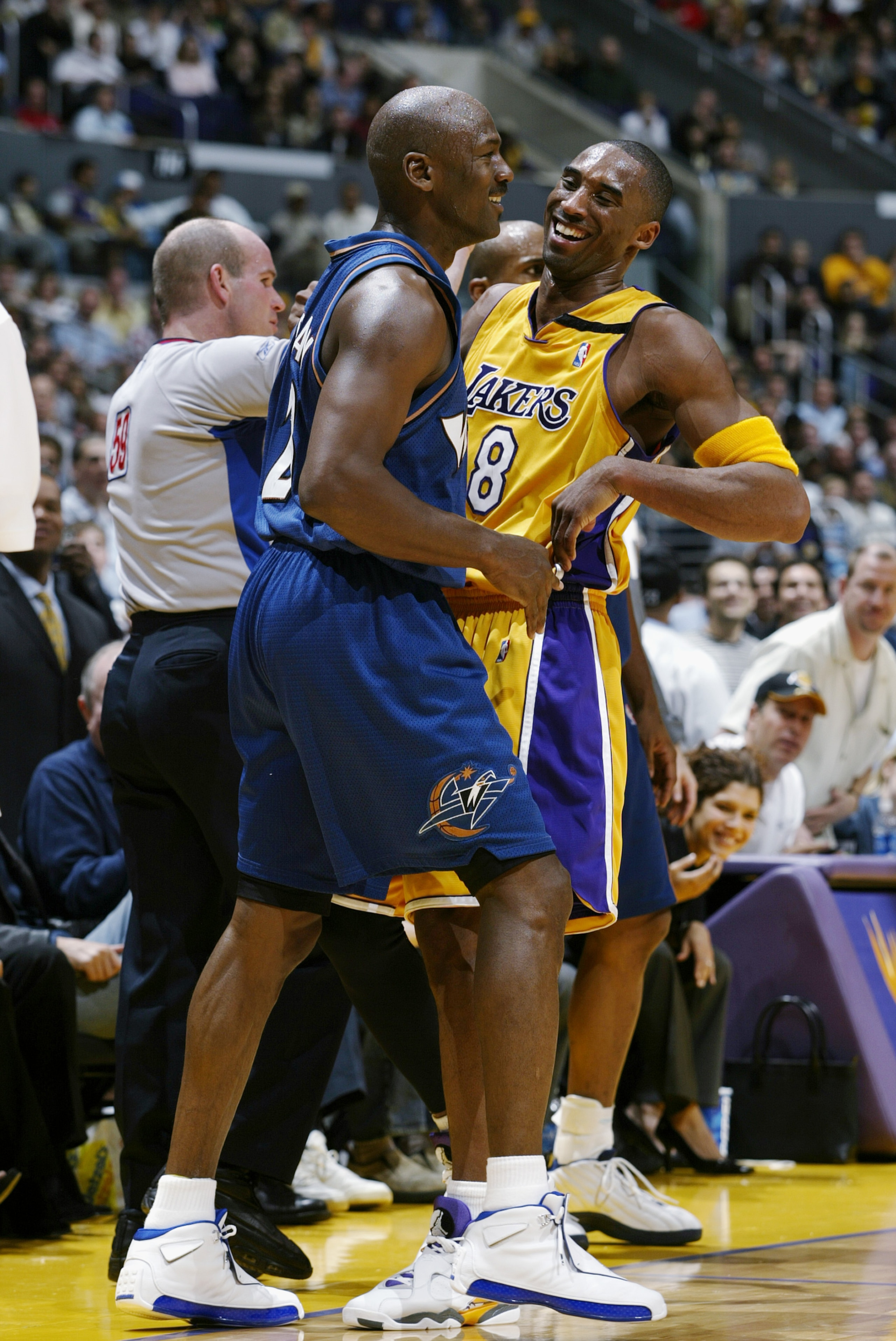 LOS ANGELES - MARCH 28: Kobe Bryant #8 of the Los Angeles Lakers shares a laugh with Michael Jordan #23 of the Washington Wizards during the game at Staples Center on March 28, 2003 in Los Angeles, California. The Lakers won 108-94. NOTE TO USER: User LOS ANGELES - MARCH 28: Kobe Bryant #8 of the Los Angeles Lakers shares a laugh with Michael Jordan #23 of the Washington Wizards during the game at Staples Center on March 28, 2003 in Los Angeles, California. The Lakers won 108-94. NOTE TO USER: User