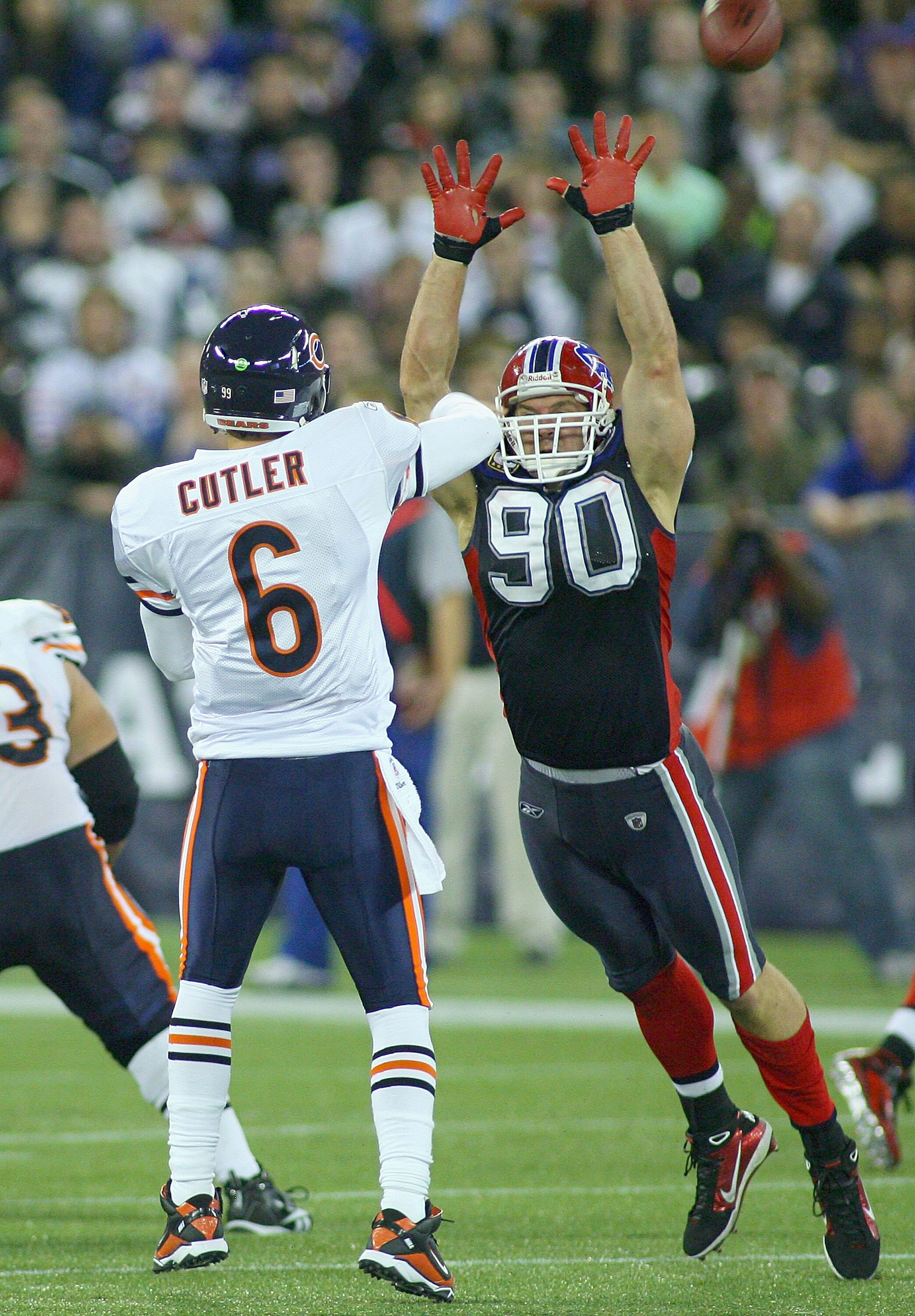 TORONTO, ON - NOVEMBER 07: Jay Cutler #6 of the Chicago Bears  throws the ball as he is pressured by Chris Kelsay #90 of the Buffalo Bills at Rogers Centre on November 7, 2010 in Toronto, Canada.  Chicago won 22-19. (Photo by Rick Stewart/Getty Images)