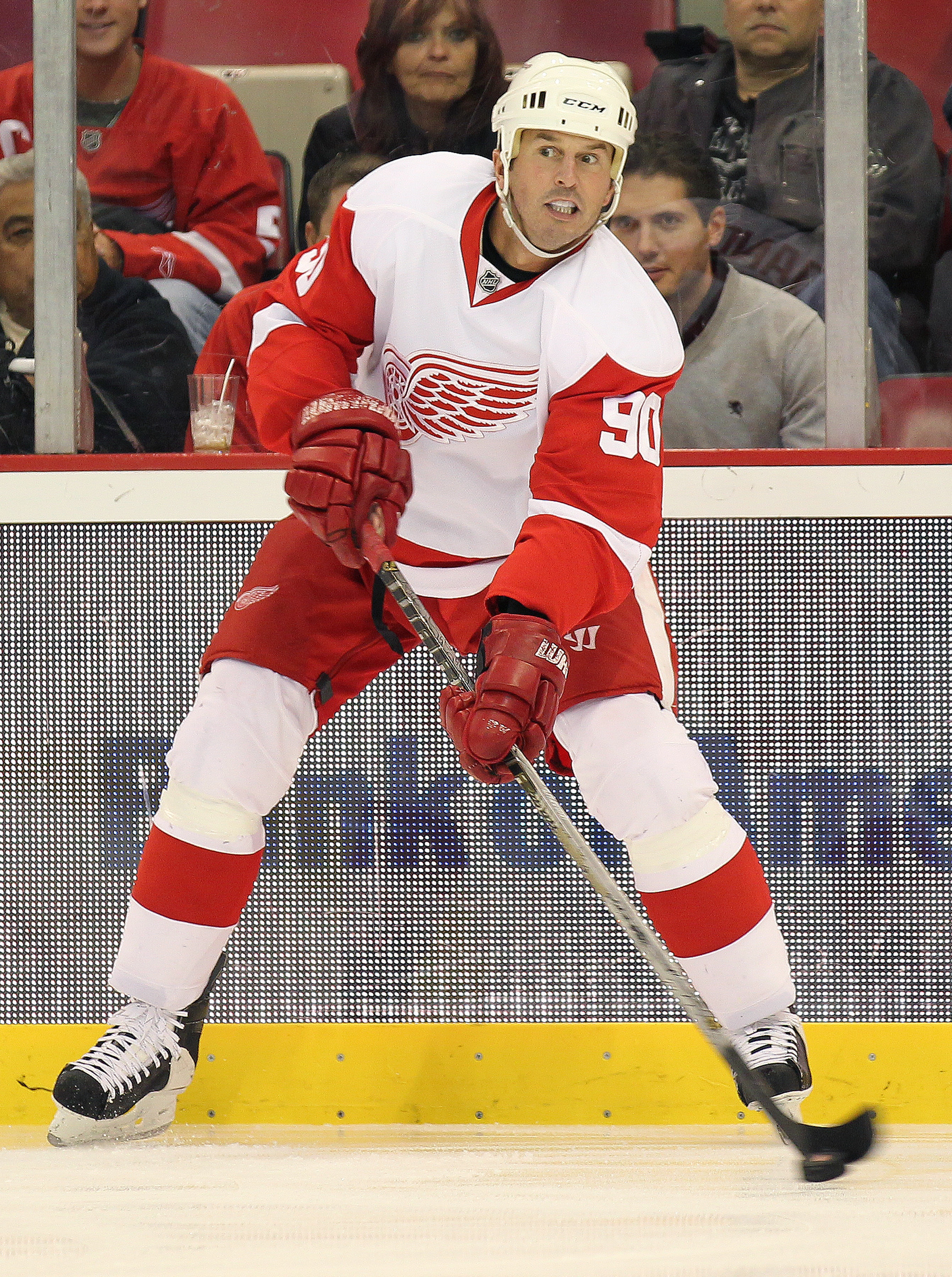 DETROIT - OCTOBER 30:  Mike Modano #90 of the Detroit Red Wings passes in a game against the Nashville Predators on October 30,2010 at the Joe Louis Arena in Detroit , Michigan. The Wings defeated the Predators 5-2. (Photo by Claus Andersen/Getty Images)