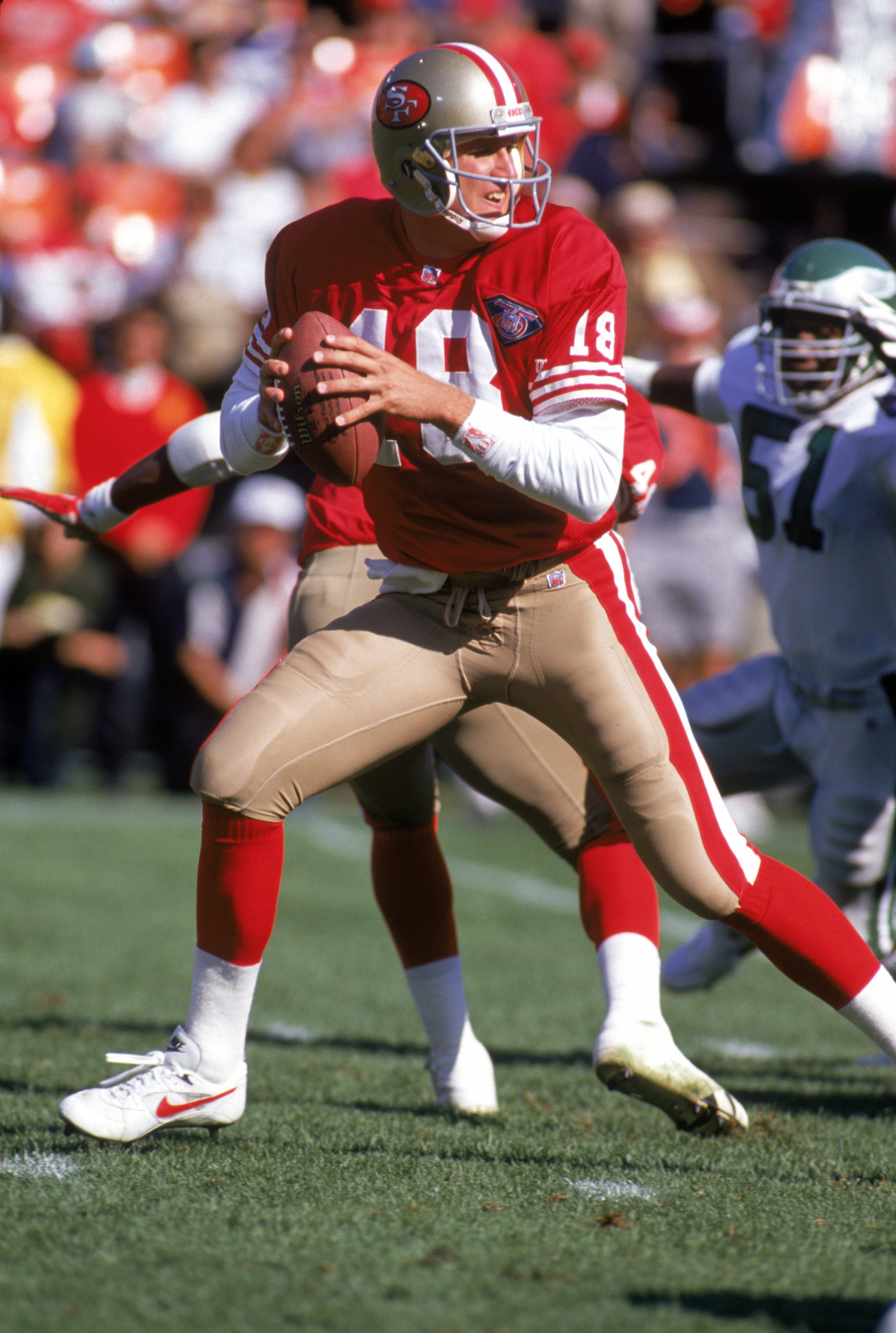 SAN FRANCISCO - OCTOBER 2:  Quarterback Elvis Grbac #18 of the San Francisco 49ers drops back to pass during a game against the Philadelphia Eagles at Candlestick Park on October 2, 1994 in San Francisco, California.  The Eagles won 40-8.  (Photo by Georg