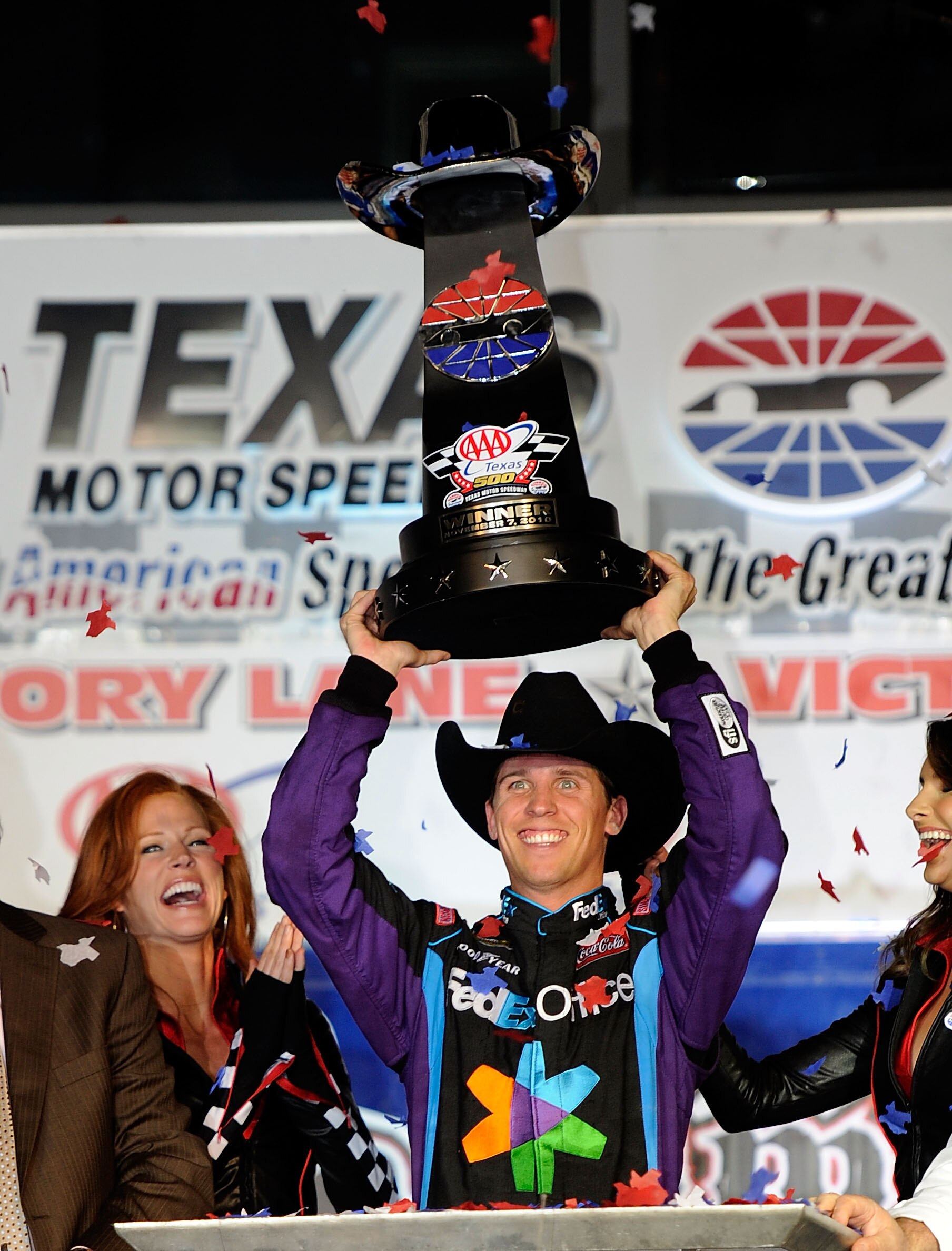 FORT WORTH, TX - NOVEMBER 07:  Denny Hamlin, driver of the #11 FedEx Office Toyota, celebrates after winning the NASCAR Sprint Cup Series AAA Texas 500 at Texas Motor Speedway on November 7, 2010 in Fort Worth, Texas.  (Photo by John Harrelson/Getty Image