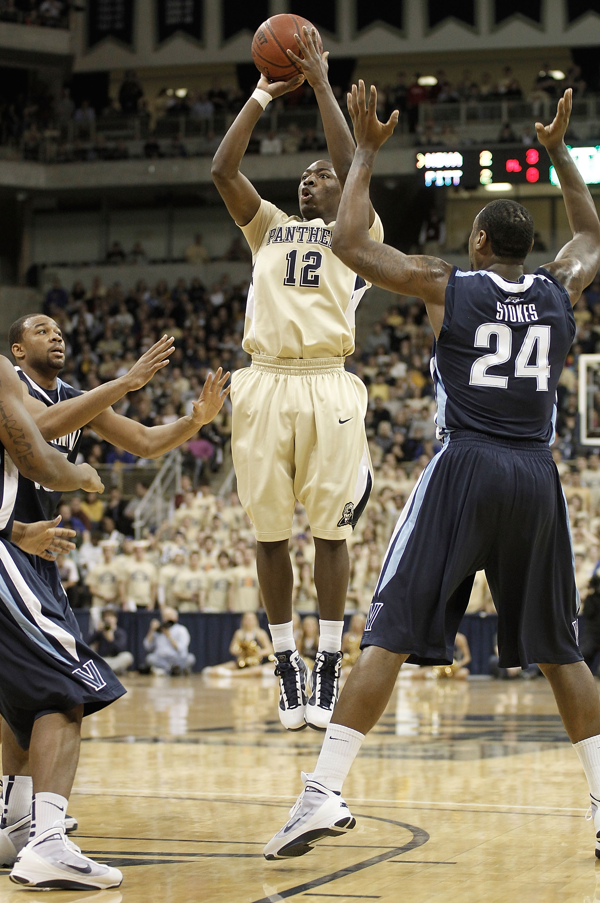 PITTSBURGH - FEBRUARY 21:  Ashton Gibbs #12 of the University of Pittsburgh Panthers goes up for a shot in front of Corey Stokes #24 of the University of Villanova Wildcats during the game on February 21, 2010 at the Petersen Events Center in Pittsburgh,