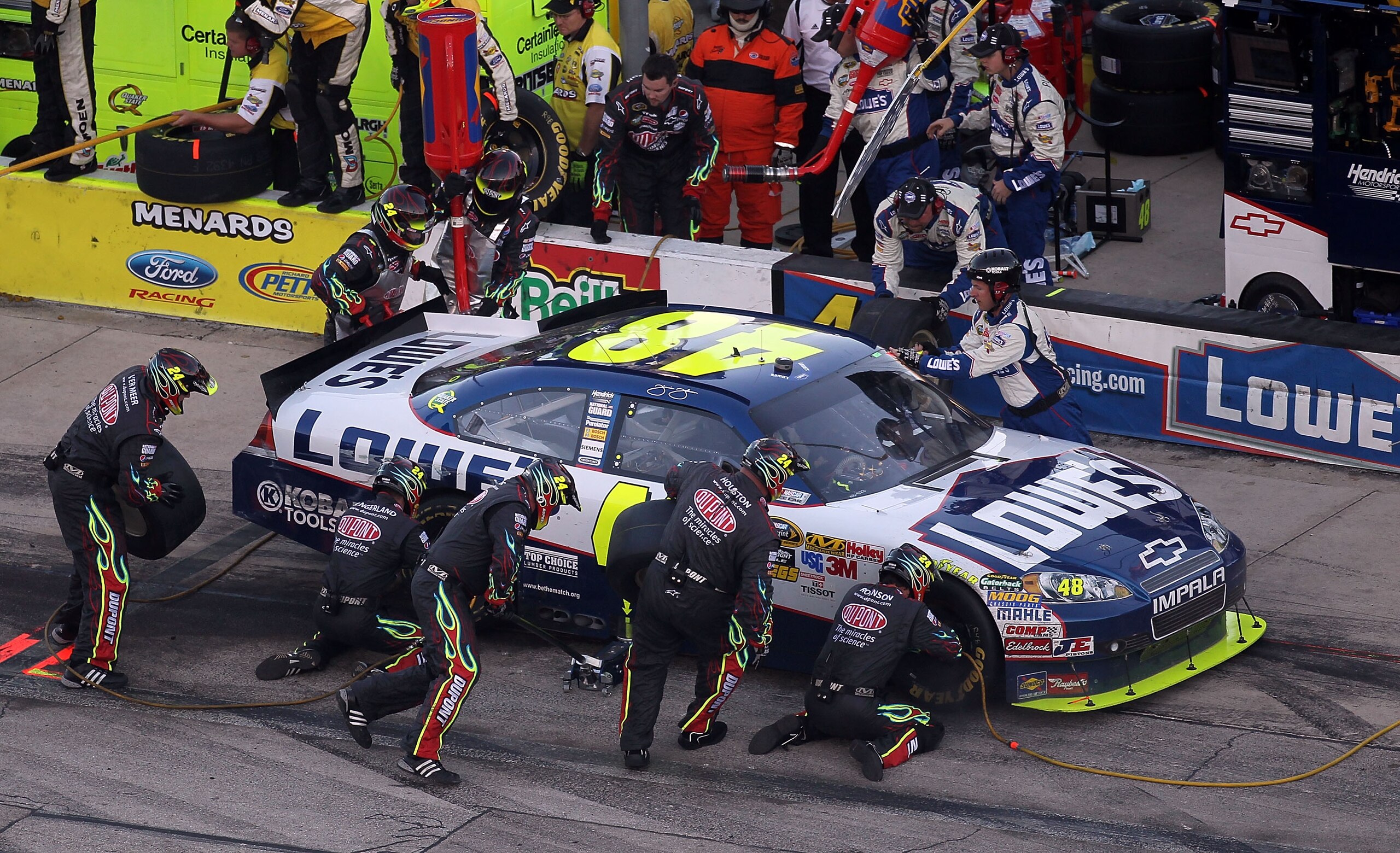FORT WORTH, TX - NOVEMBER 07: Jimmie Johnson, driver of the #48 Lowe's Chevrolet, makes a pit stop during the NASCAR Sprint Cup Series AAA Texas 500 at Texas Motor Speedway on November 7, 2010 in Fort Worth, Texas. (Photo by Jonathan Ferrey/Getty Image FORT WORTH, TX - NOVEMBER 07: Jimmie Johnson, driver of the #48 Lowe's Chevrolet, makes a pit stop during the NASCAR Sprint Cup Series AAA Texas 500 at Texas Motor Speedway on November 7, 2010 in Fort Worth, Texas. (Photo by Jonathan Ferrey/Getty Image