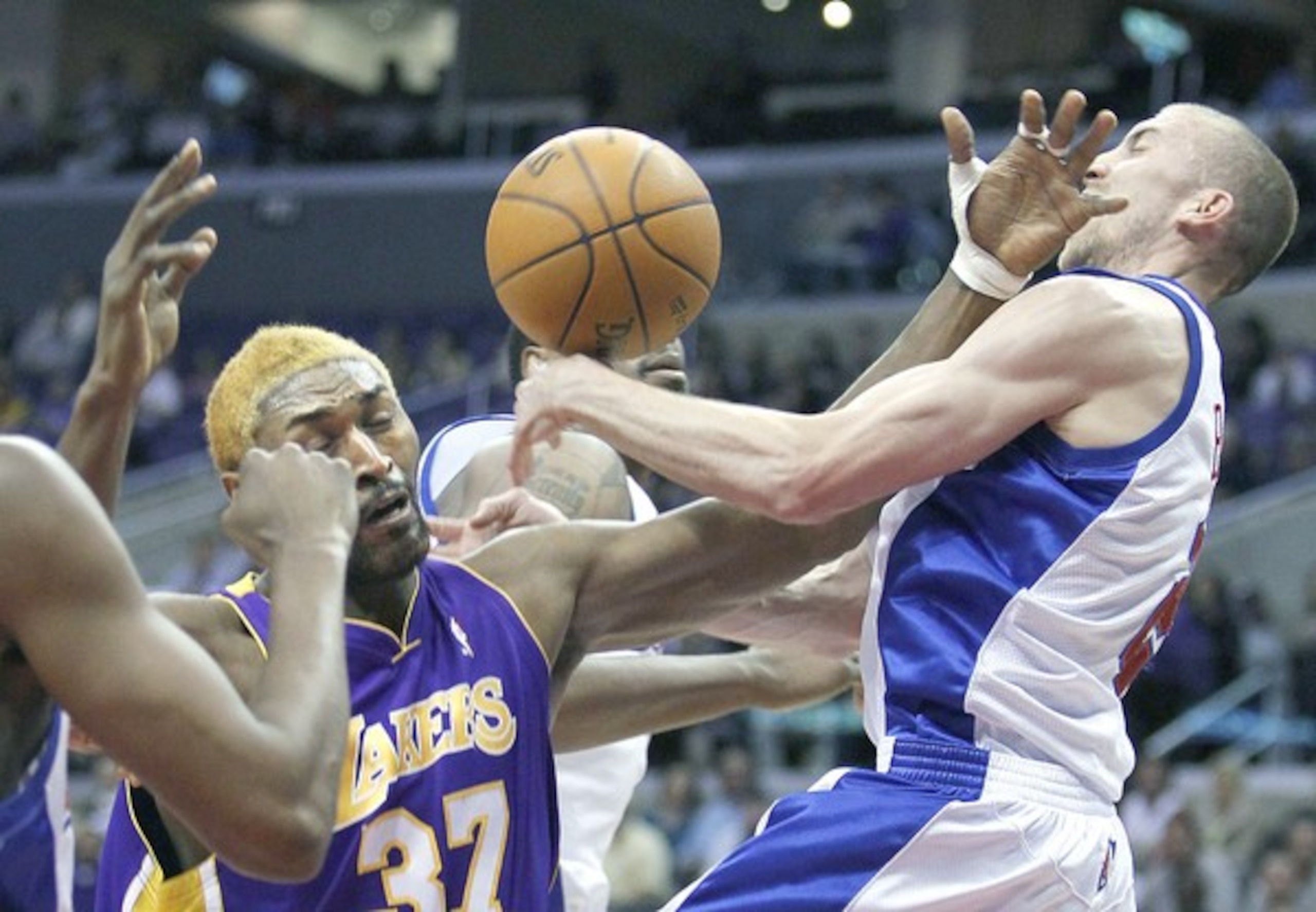Any guess to the guard Artest is smacking? Look familiar, like the Lakers' new backup point guard Steve Blake?