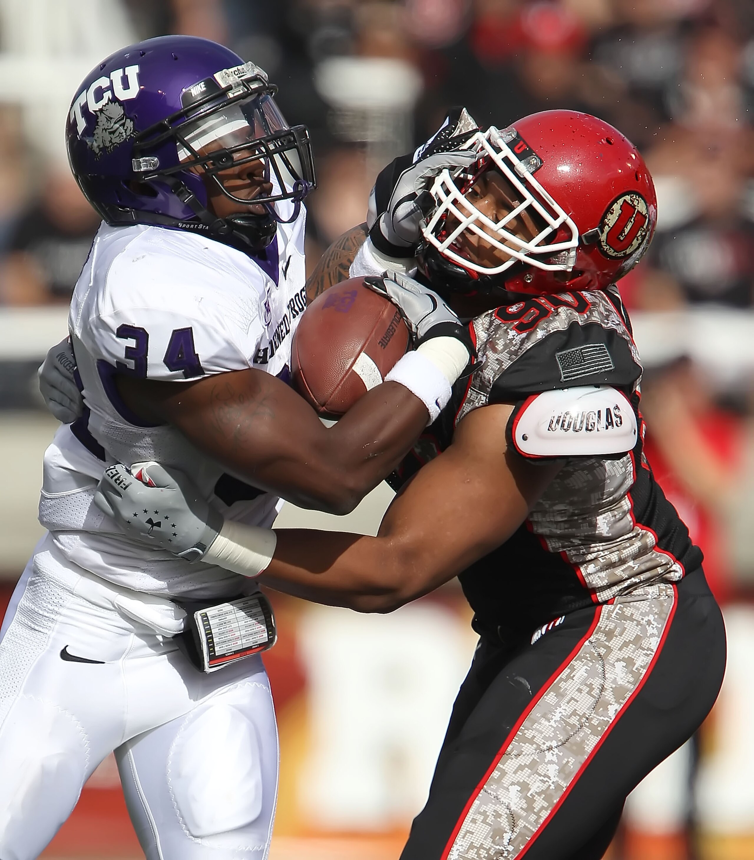 SALT LAKE CITY, UT - NOVEMBER 6: Derrick Shelby #90 of the Utah Utes hits Ed Wesley #34 of the TCU Horned Frogs during the first half of an NCAA football game November 6, 2010 at Rice-Eccles Stadium in Salt Lake City, Utah. (Photo by George Frey/Getty Ima