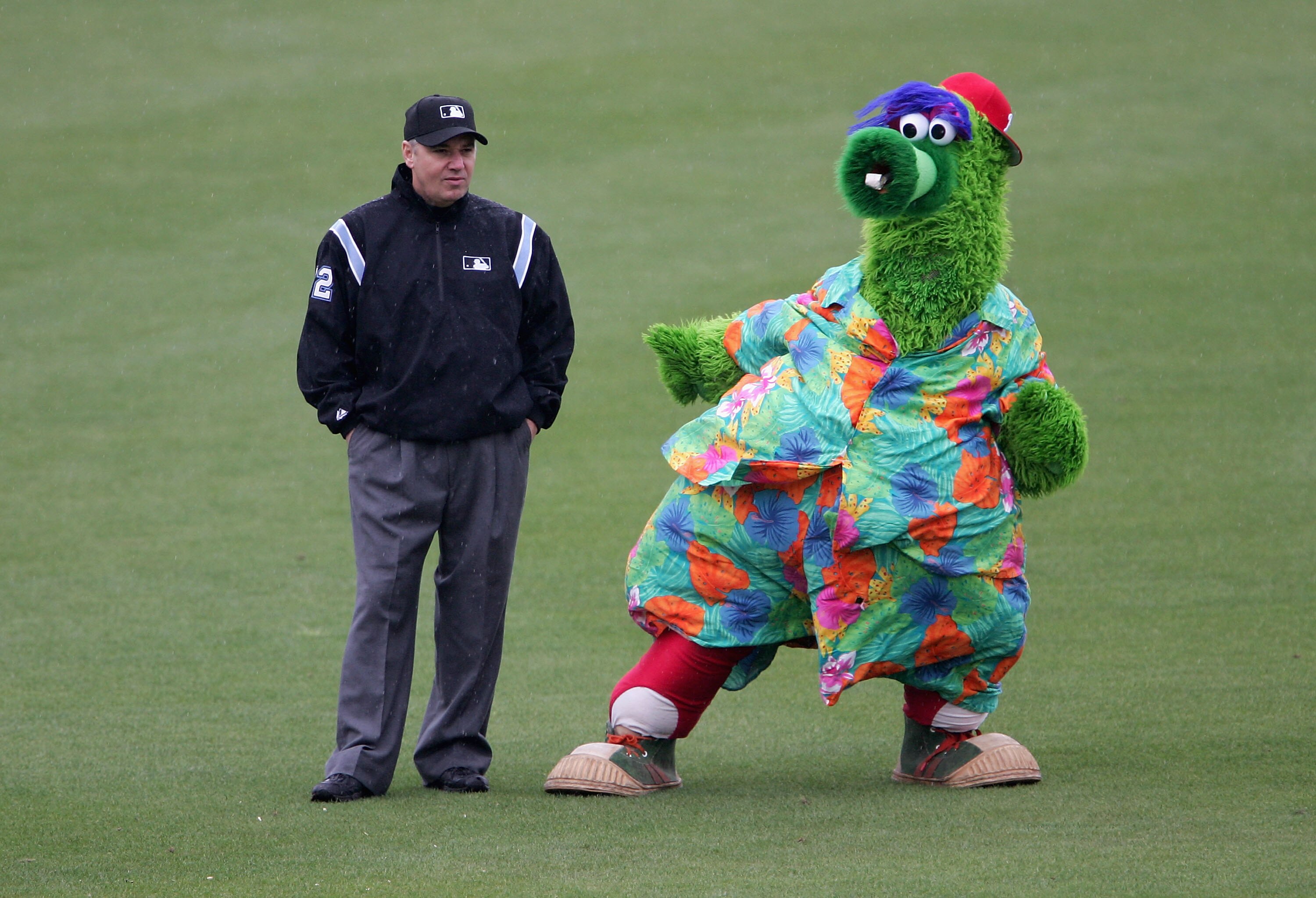 CLEARWATER, FL - MARCH 3:  The Phillie Phanatic jokes with thirdbase umpire Tom Hallion beween innings as the Detroit Tigers defeated the Philadelphia Phillies 9-1 during MLB spring training action at the Bright House Networks Field March 3, 2005 in Clear
