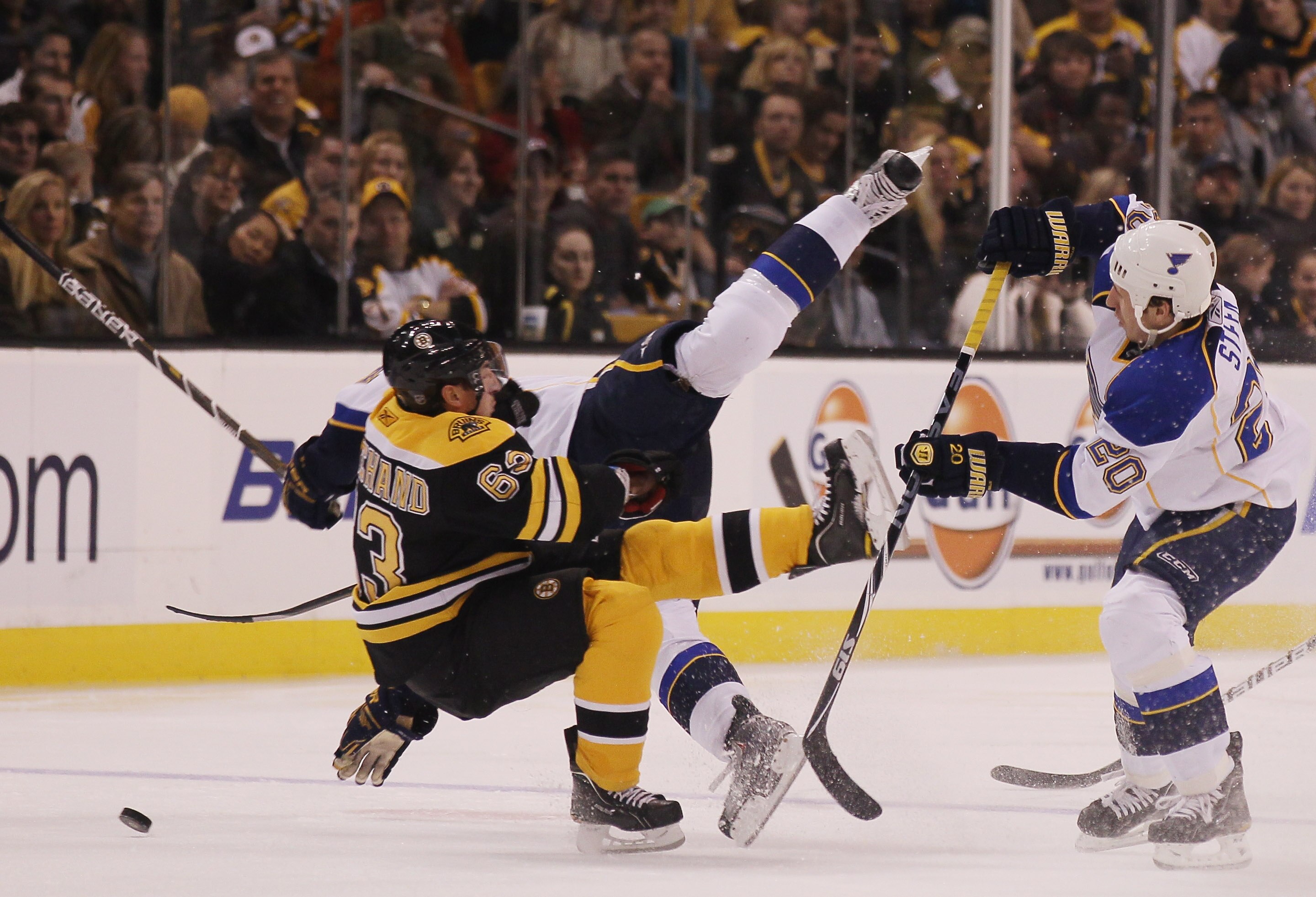 BOSTON - NOVEMBER 06:  Brad Marchand #63 of the Boston Bruins and Alex Pietrangelo #27 of the St. Louis Blues collide as Alexander Steen #20 of the Blues stands by on November 6, 2010 at the TD Garden in Boston, Massachusetts.  (Photo by Elsa/Getty Images