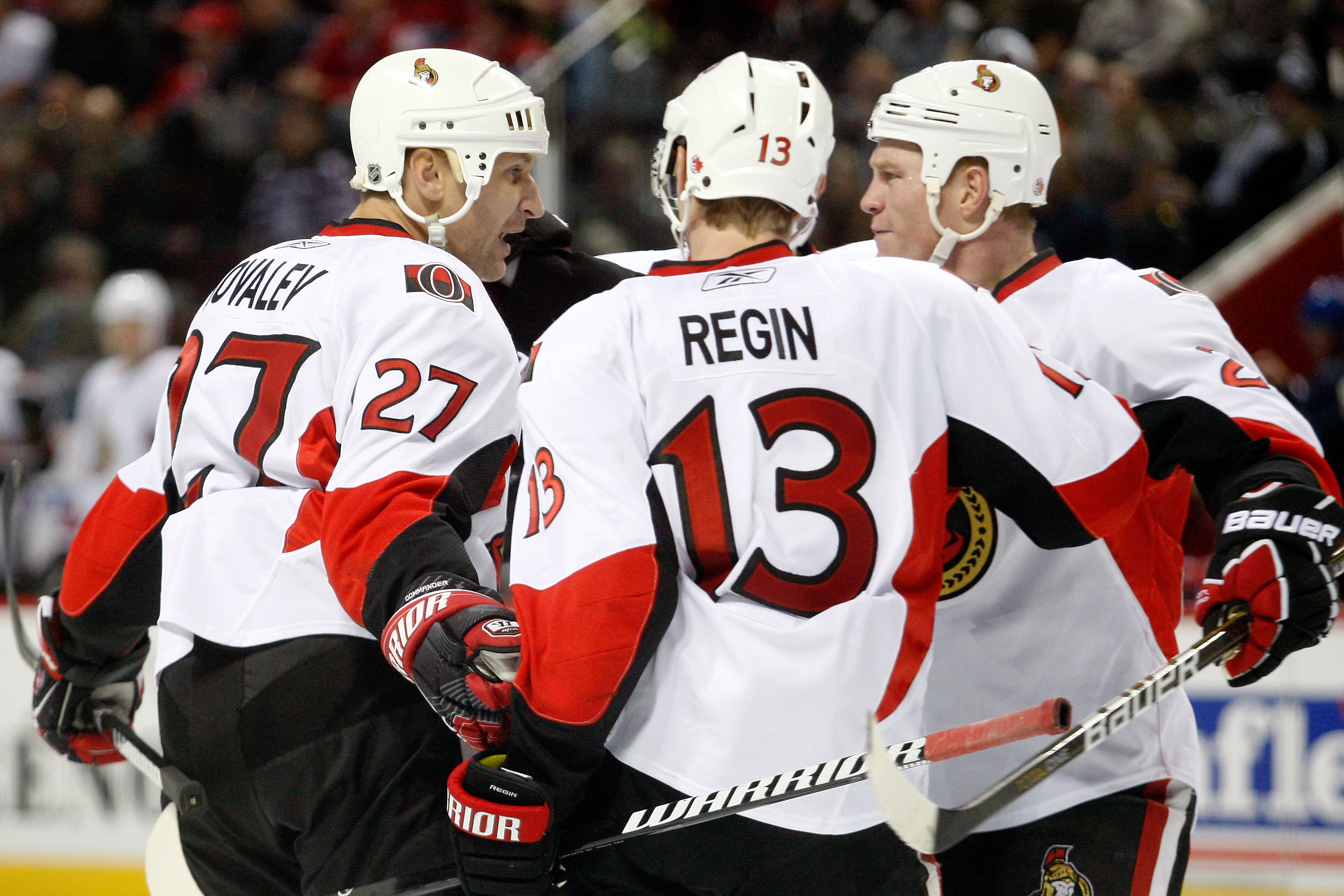 MONTREAL- NOVEMBER 6:  Alexei Kovalev #27 of the Ottawa Senators celebrates his third period goal with teammates Chris Neil #25 and Peter Regin #13 during the NHL game against the Montreal Canadiens at the Bell Centre on November 6, 2010 in Montreal, Queb