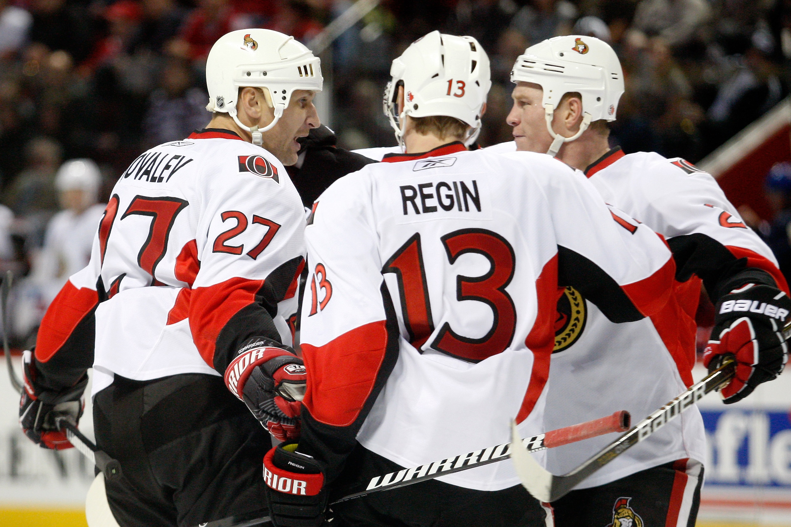 MONTREAL- NOVEMBER 6:  Alexei Kovalev #27 of the Ottawa Senators celebrates his third period goal with teammates Chris Neil #25 and Peter Regin #13 during the NHL game against the Montreal Canadiens at the Bell Centre on November 6, 2010 in Montreal, Queb