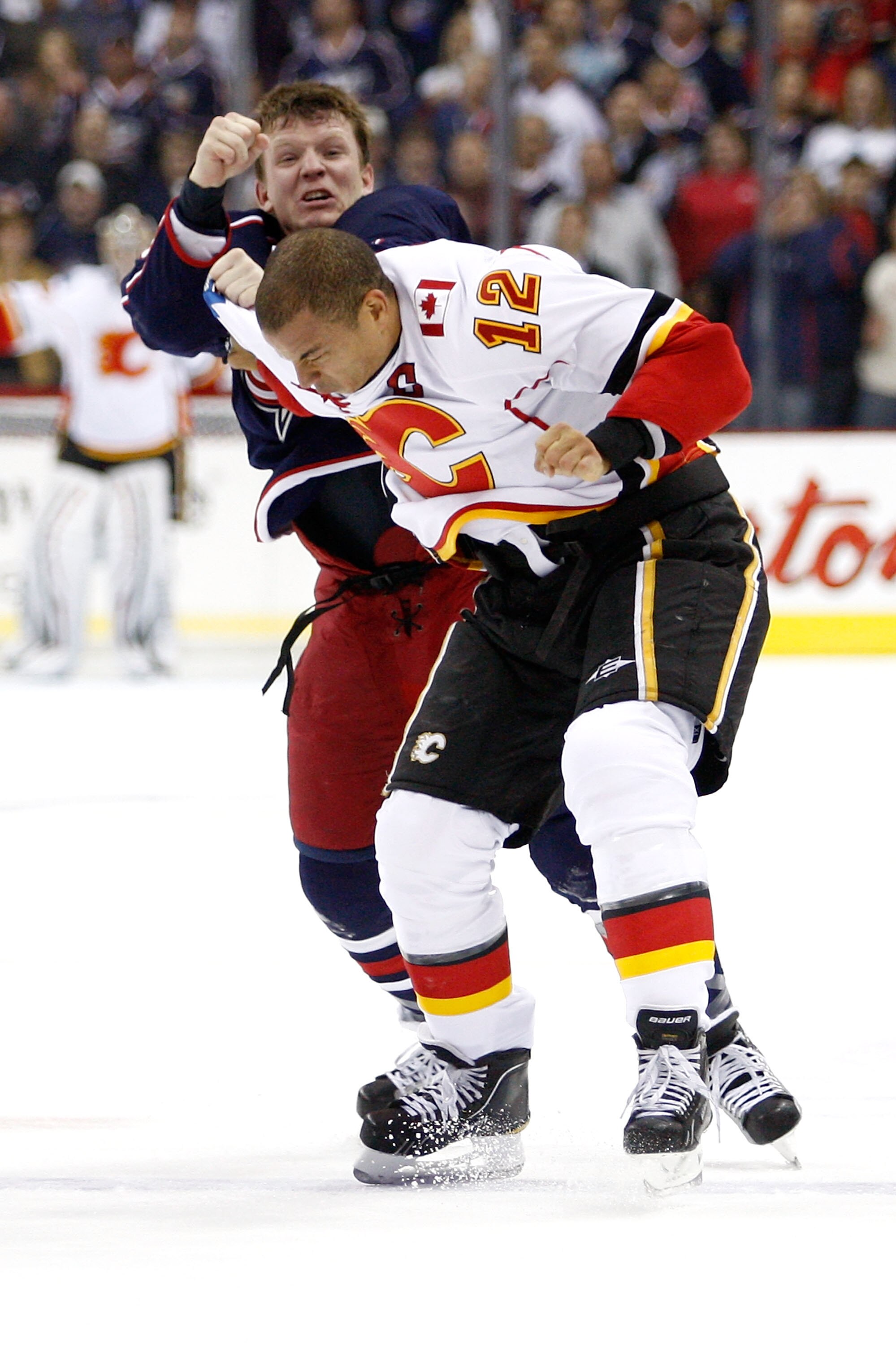 COLUMBUS, OH - OCTOBER 22:  Derek Dorsett #15 of the Columbus Blue Jackets throws a punch while fighting with Jarome Iginla #12 of the Calgary Flames during the first period on October 22, 2010 at Nationwide Arena in Columbus, Ohio.  (Photo by John Griesh